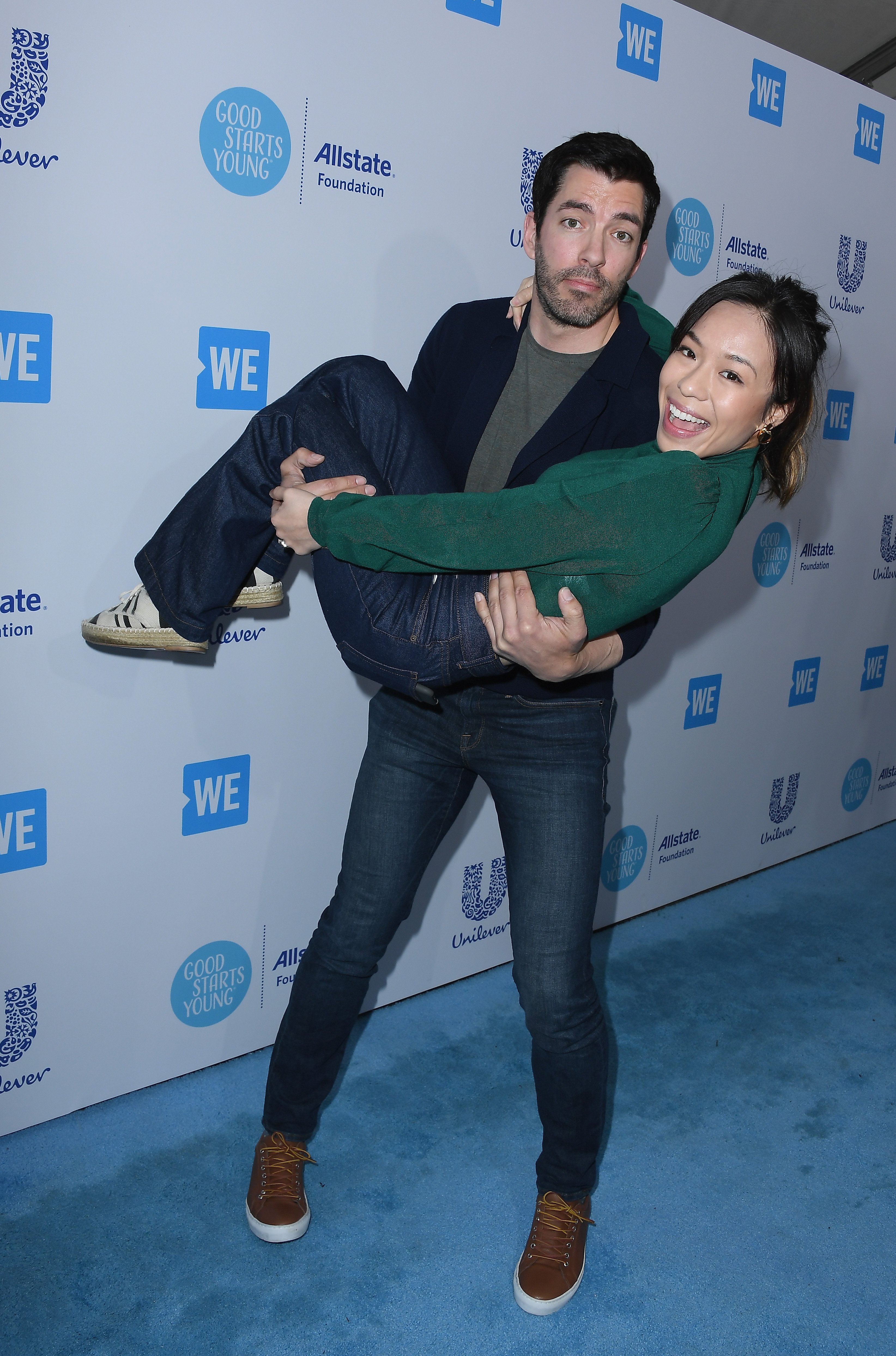 Drew Scott (L) and Linda Phan attend WE Day California at The Forum on April 19, 2018 in Inglewood, California. | Source: Getty Images