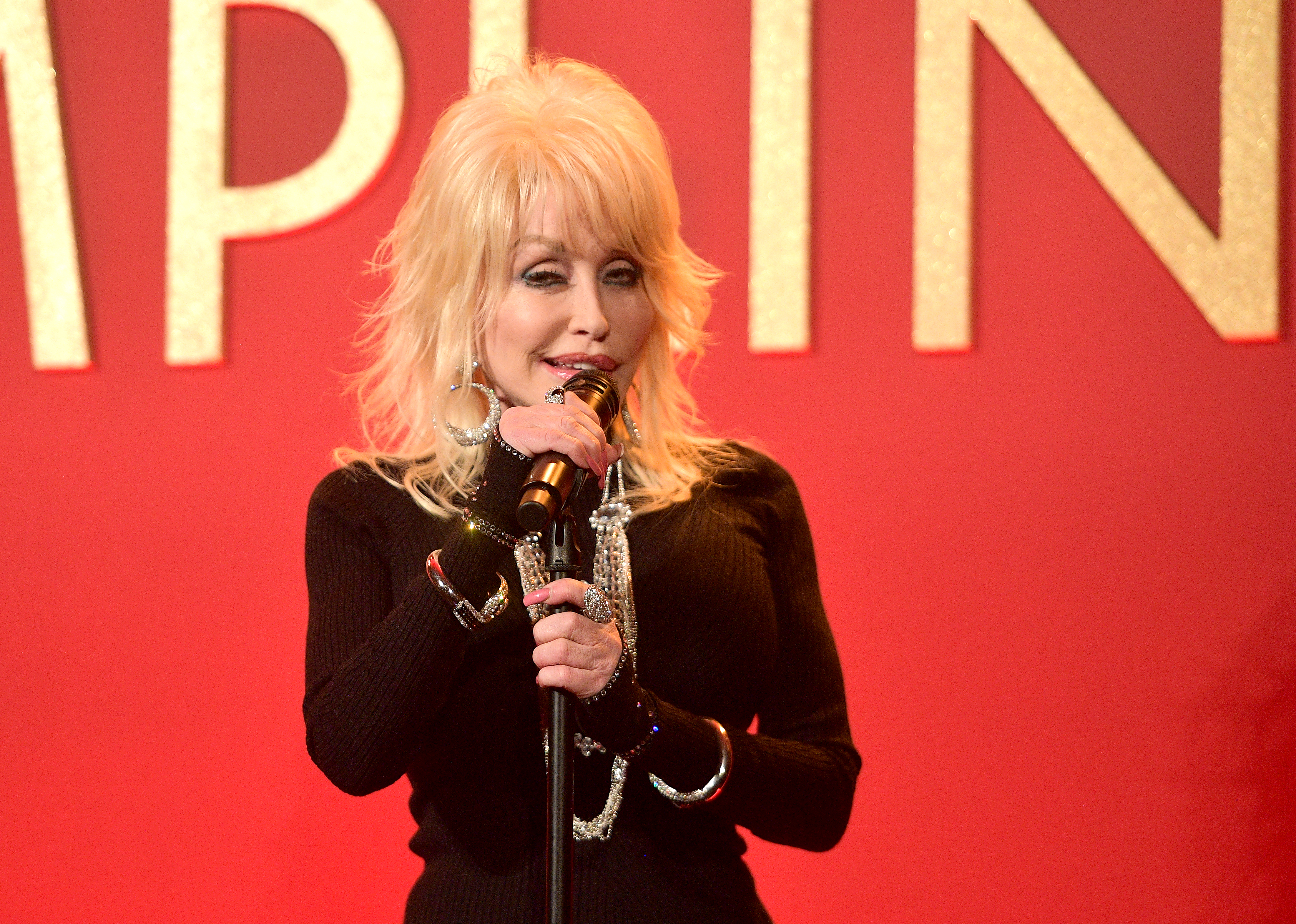 Dolly Parton performs onstage at a luncheon for the Netflix Film Dumplin' at Four Seasons Hotel Los Angeles at Beverly Hills on October 22, 2018 in Los Angeles, California | Source: Getty Images