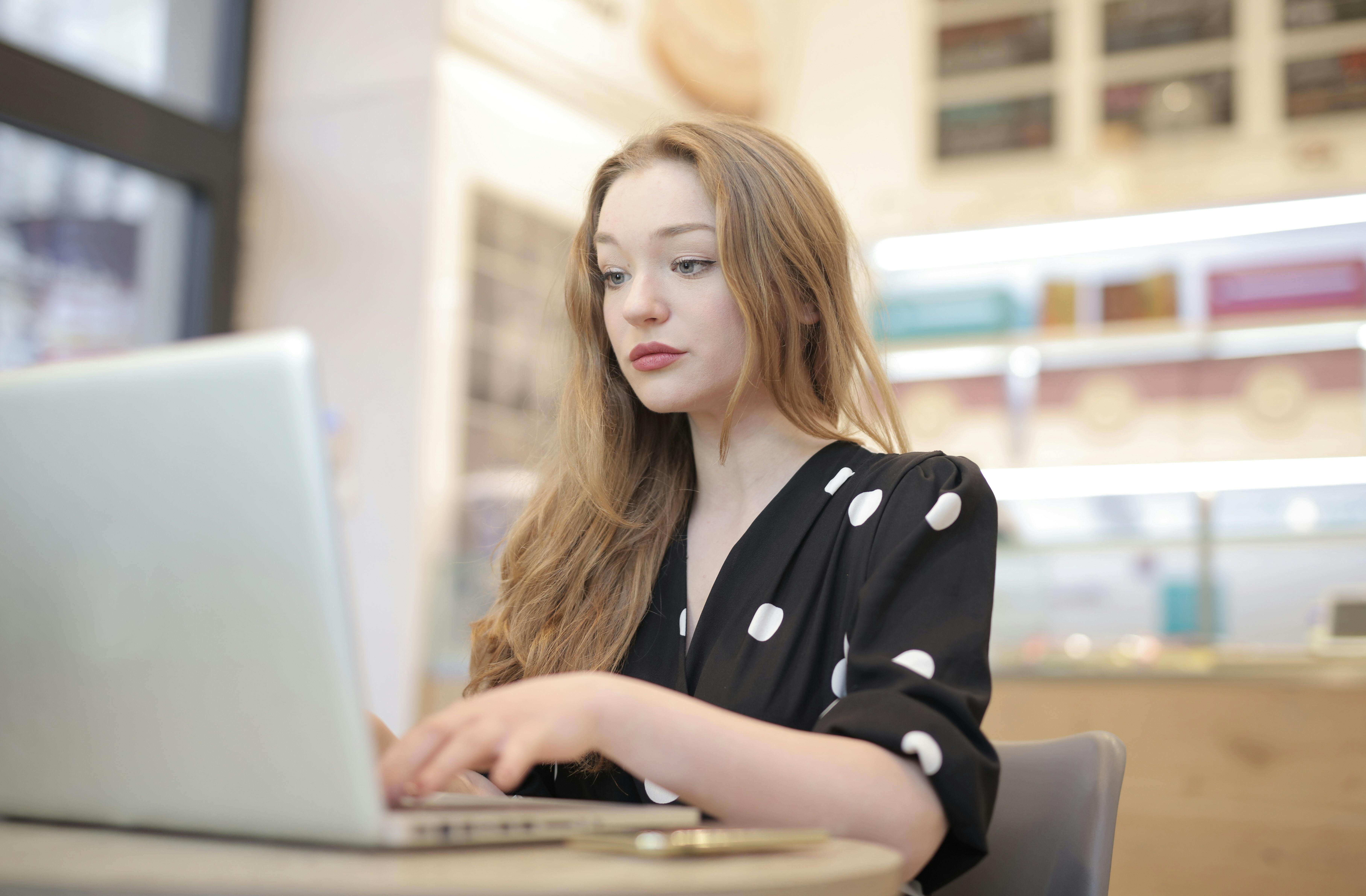 A woman watching footage on her laptop | Source: Pexels