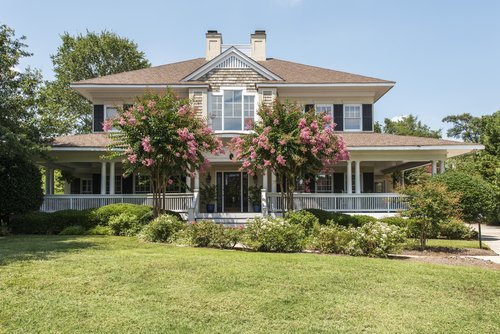 Southern home with wrap around porch. | Source: Shutterstock. 