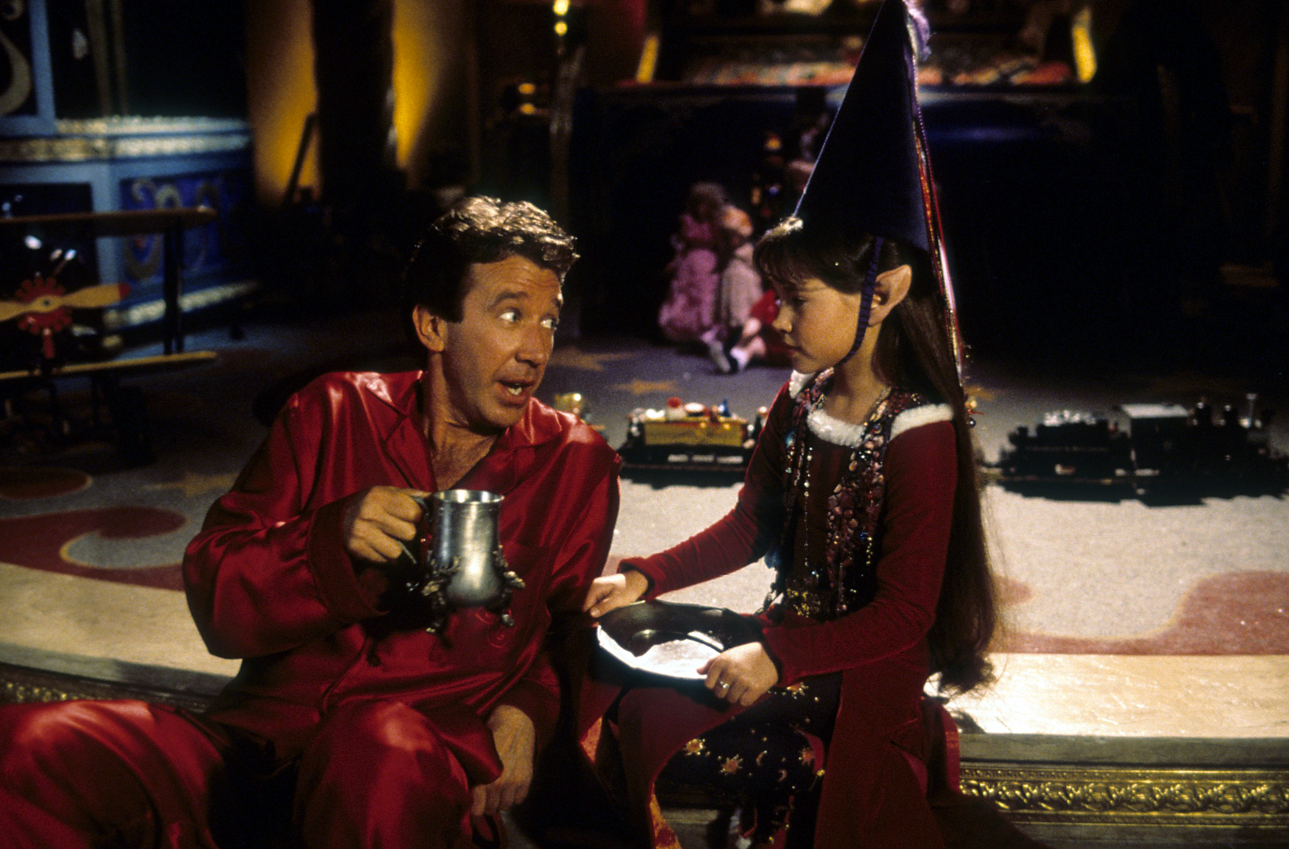 Tim Allen with Paige Tamada as Elf-Judy in a scene from "The Santa Clause" in 1994. | Source: Getty Images