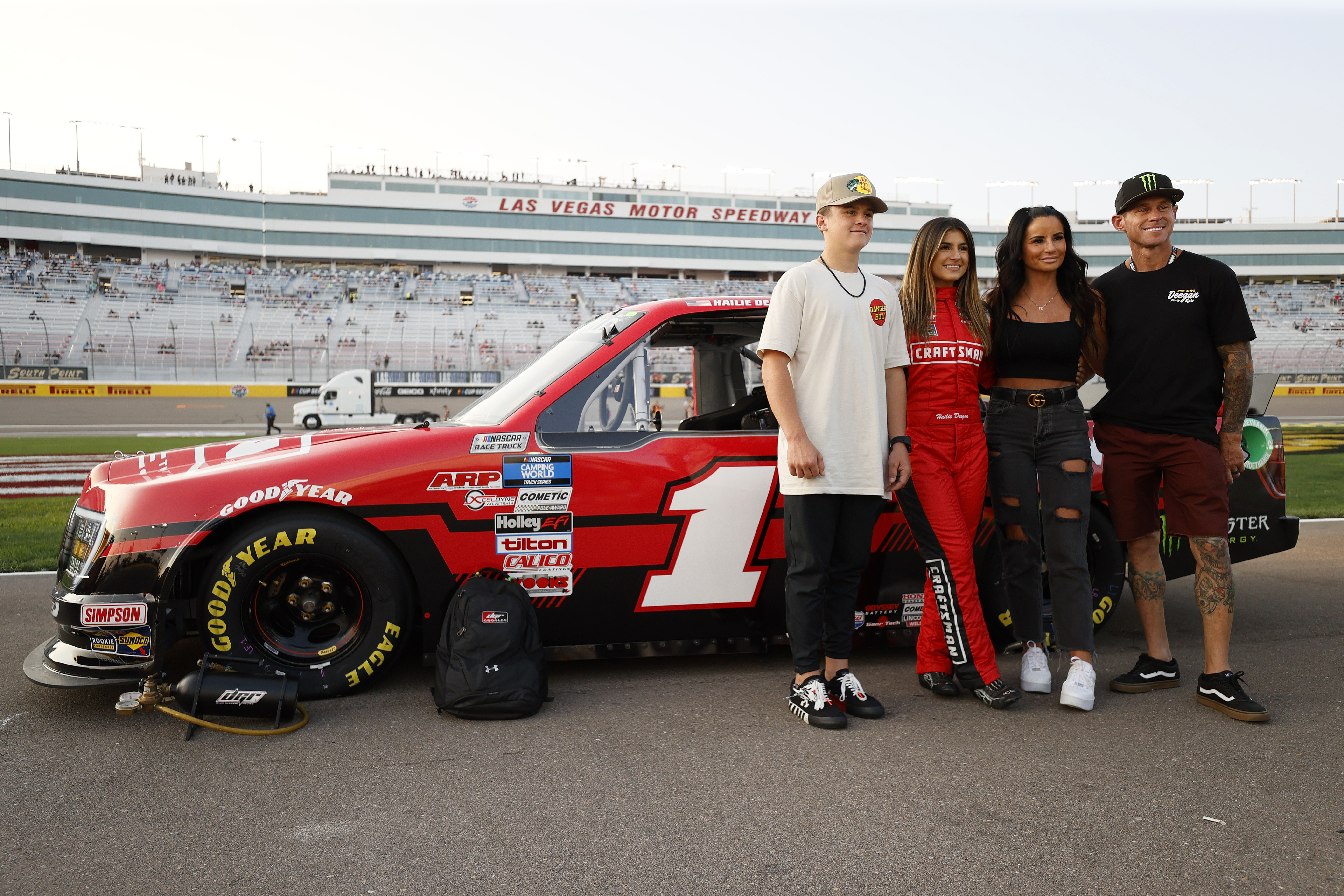 (L-R) Haiden, Hailie, Marissa, and Brian Deegan pose on the grid of the NASCAR Camping World Truck Series Victoria's Voice Foundation 200 presented by Westgate Resorts at Las Vegas Motor Speedway on September 24, 2021 in Las Vegas, Nevada. | Source: Getty Images