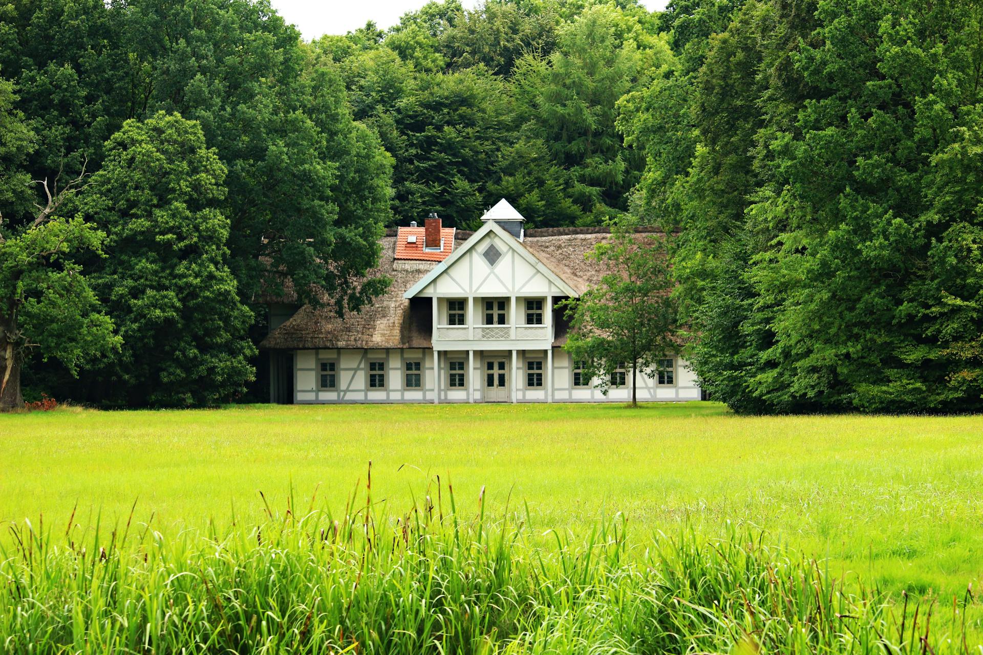 A concrete house near a field | Source: Pexels