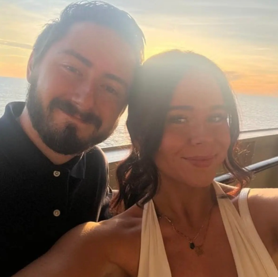 Madeline Spatafore and Ryan Hosso pose for a selfie together at sunset by the water. | Source: Facebook/Mark Dohner﻿