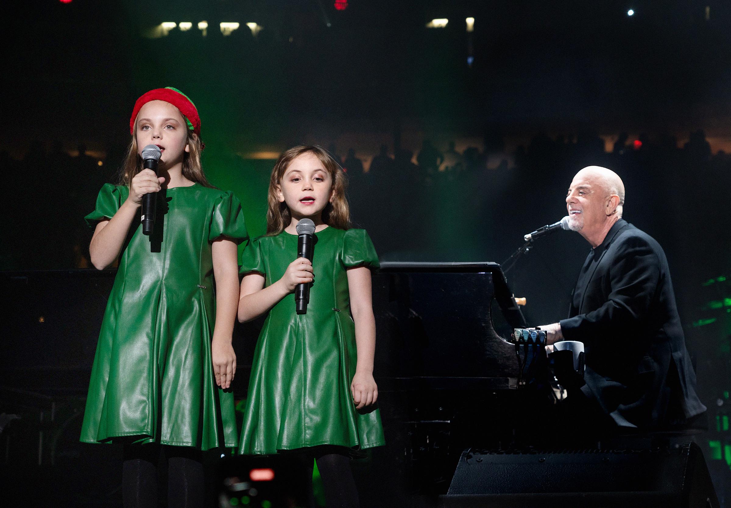 Billy Joel performs with Della and Remy Joel at Madison Square Garden on December 19, 2023, in New York City | Source: Getty Images