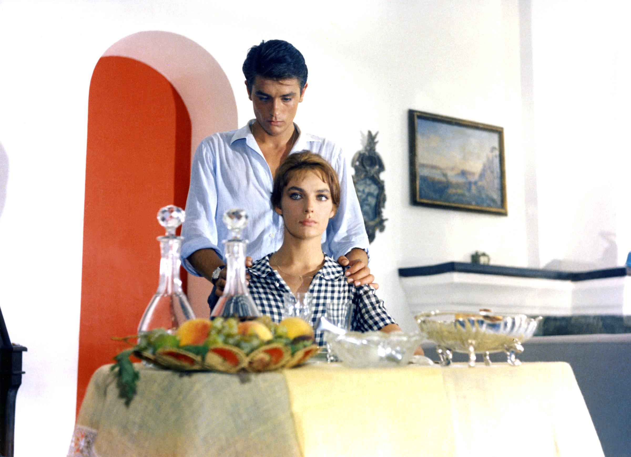 Alain Delon and Marie Laforêt on the set of "Purple Noon," circa 1960. | Source: Getty Images