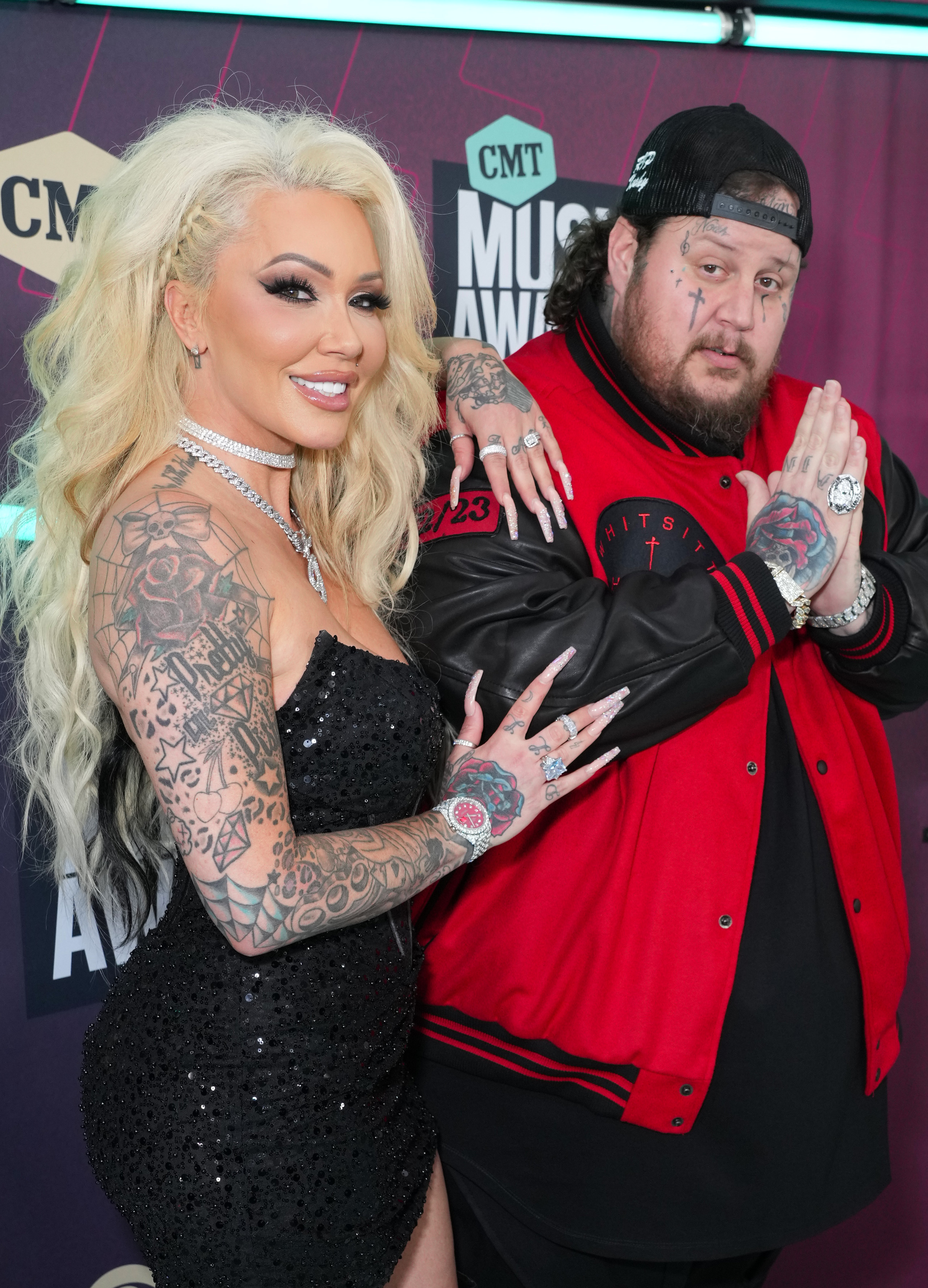 Jelly Roll and Bunnie XO pose together at an event. Bunnie later revealed that losing four embryos and grieving her parents left her feeling as though she had "lost my sparkle." | Source: Getty Images