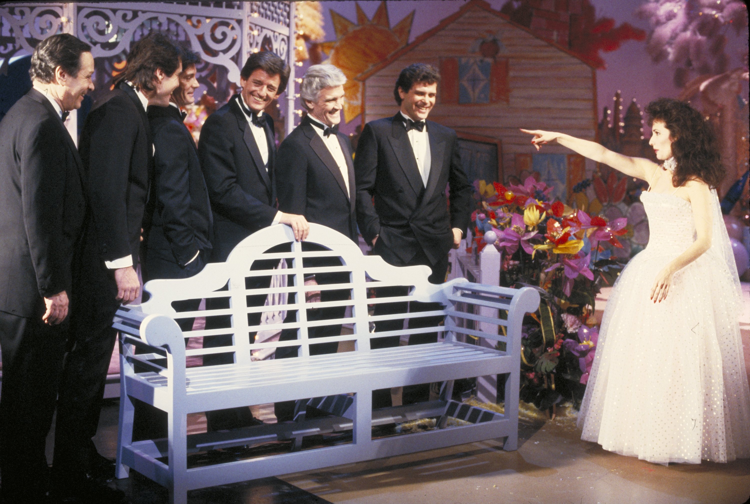 Susan Lucci as Erica Kane with Nick Benedict as Phillip Brent and her other TV husbands in an episode of "All My Children" in 1988 | Source: Getty Images