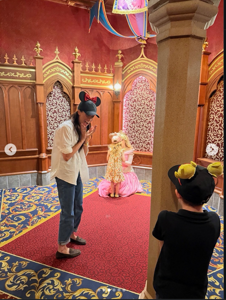 Meghan Markle and Prince Archie look on as Princess Lilibet meets Sleeping Beauty's Princess Aurora, from a post dated May 11, 2026 | Source: Instagram/meghan