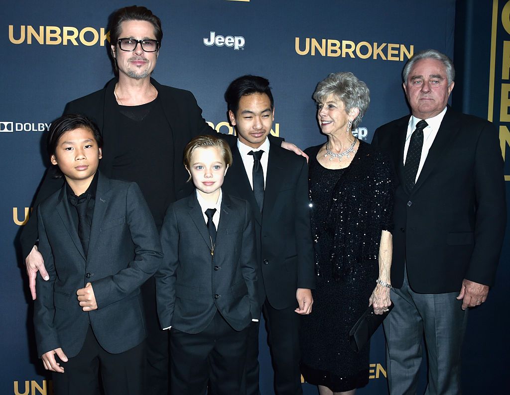 Brad Pitt with children Pax, Shiloh and Maddox Jolie-Pitt, and his parents Jane, and William Pitt the premiere of "Unbroken" in 2014 in Hollywood | Source: Getty Images