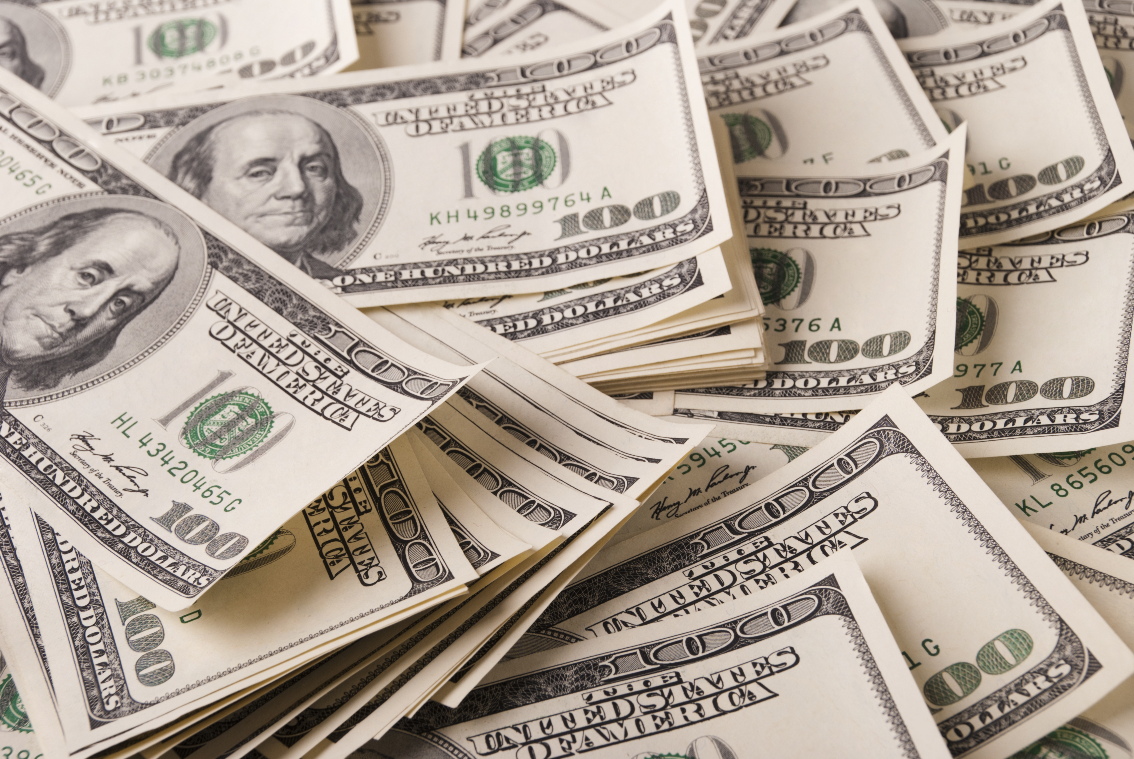 A pile of $100 dollar bills | Source: Shutterstock