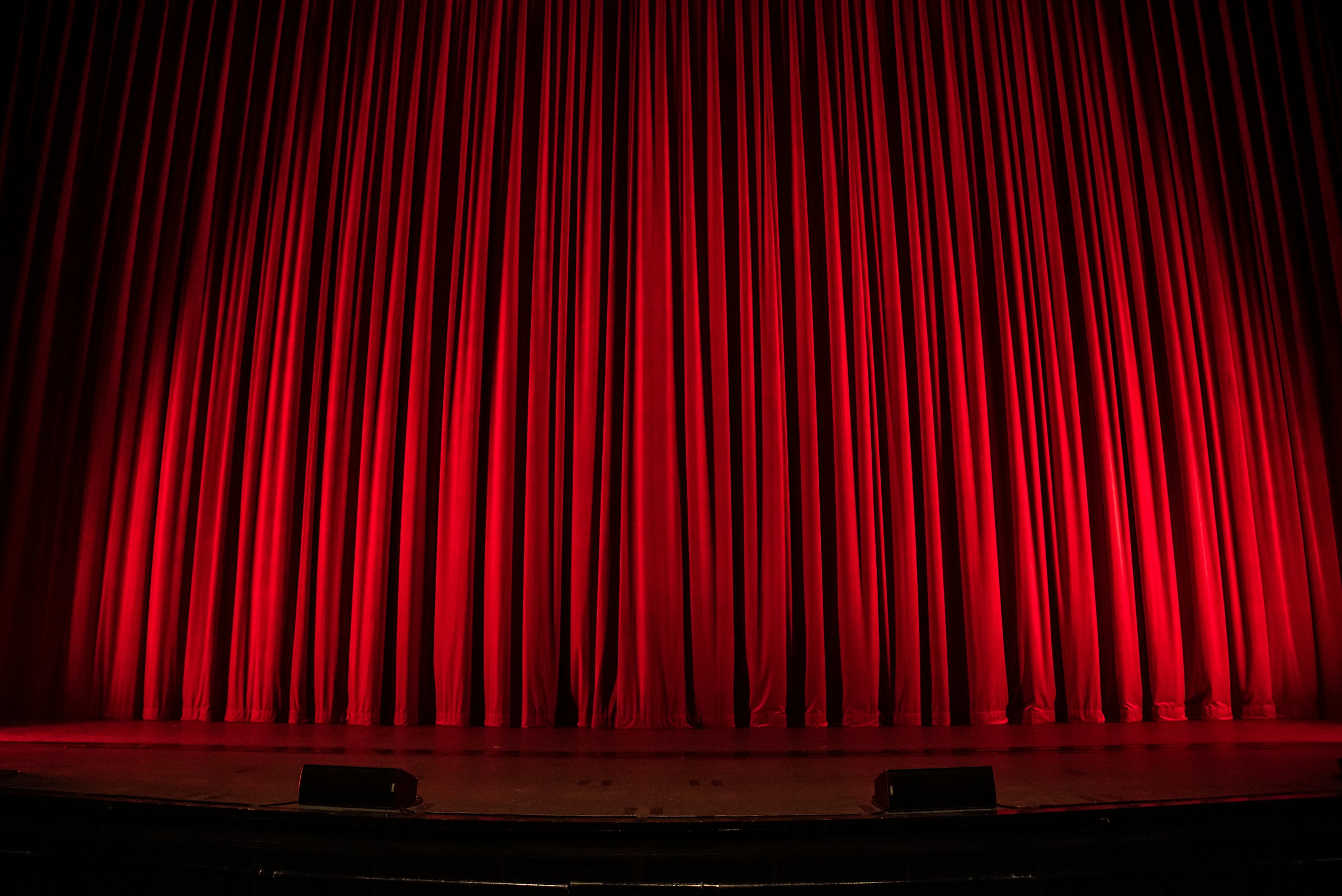 A red curtain at a theatre | Source: Unsplash