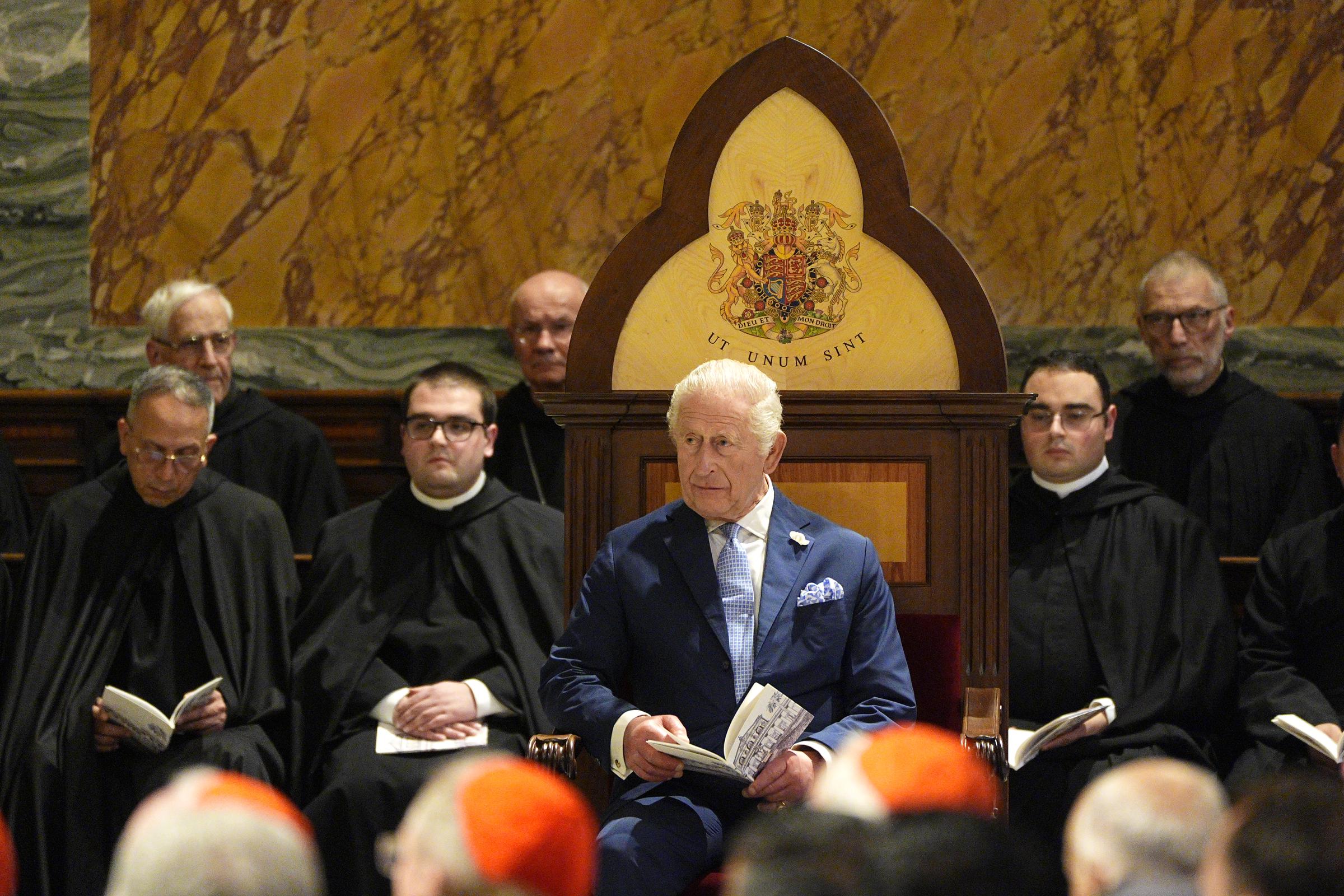 King Charles III sits in a specially created seat, displaying his Coat of Arms given as a gift given in honour of becoming Royal Confrater of the Abbey on October 23, 2025 | Source: Getty Images