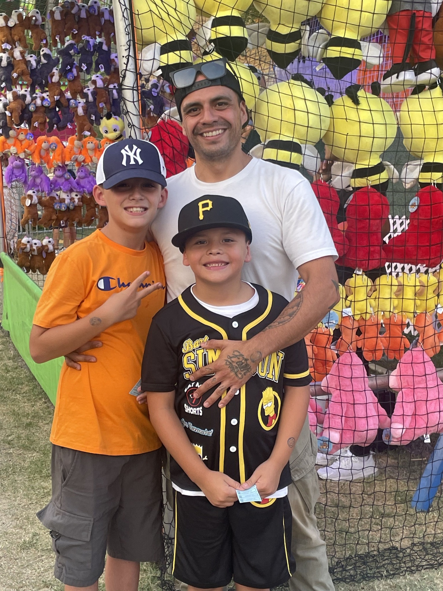 Giovanni, Callan, and Noah Perez at a fair, from a post dated April 21, 2026 | Source: Facebook/Frank Perez
