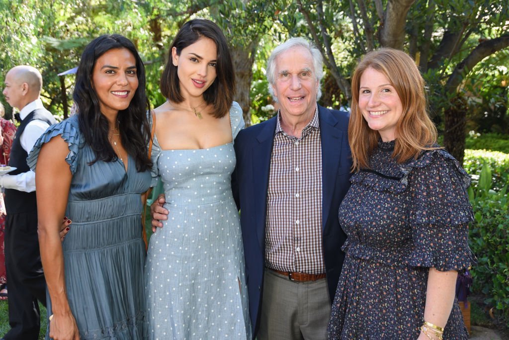 Elsa Collins, Eliza Gonzalez, Henry Winkler, and Zoe Winkler attend a high tea event. | Source:Getty Images