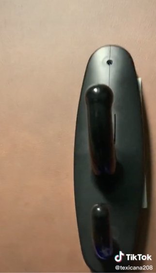 A coat hook camera Vanessa Lee claimed to have found in the office bathroom. | Source: tiktok.com/@texicana208