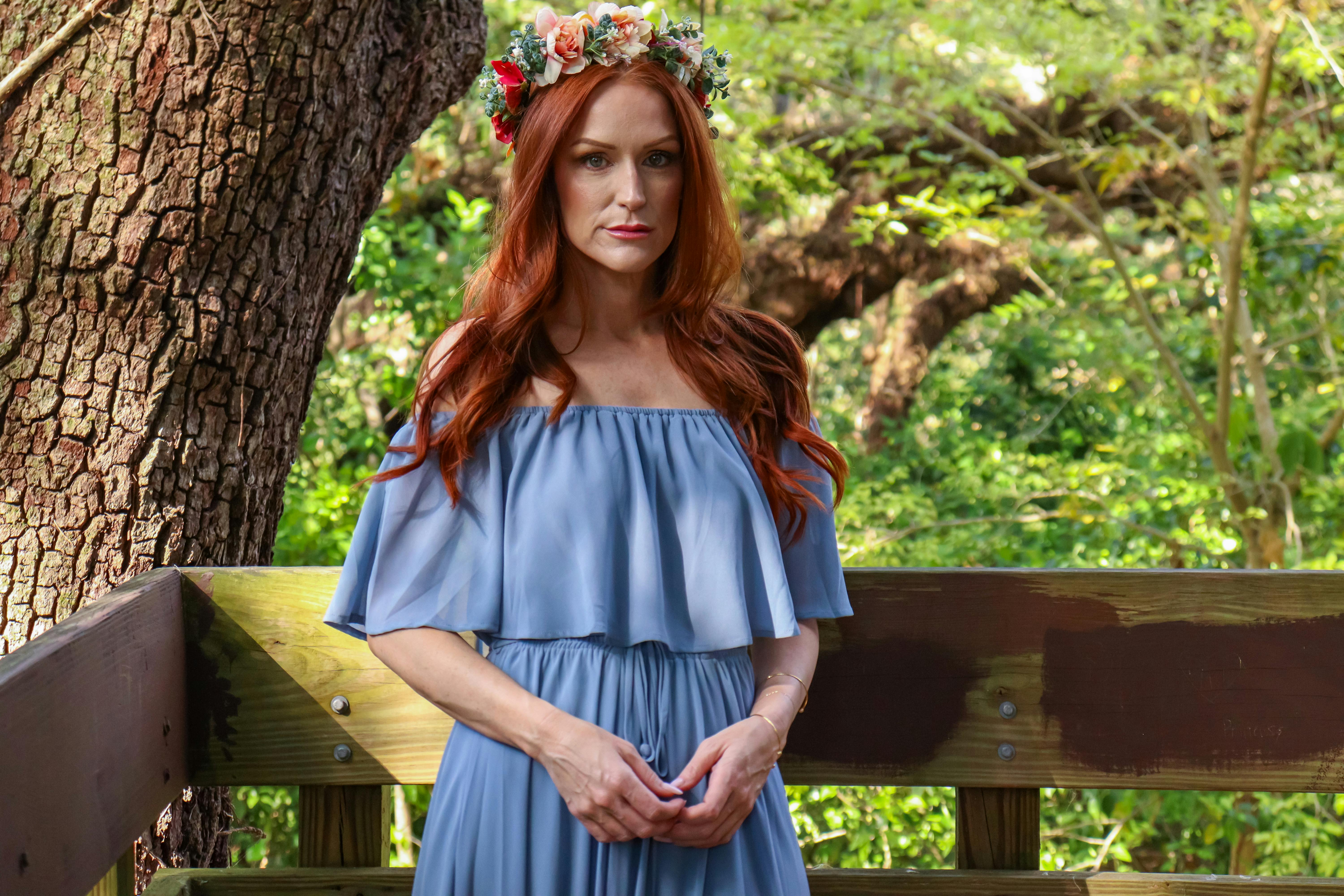 A woman wearing a dusty blue dress | Source: Pexels