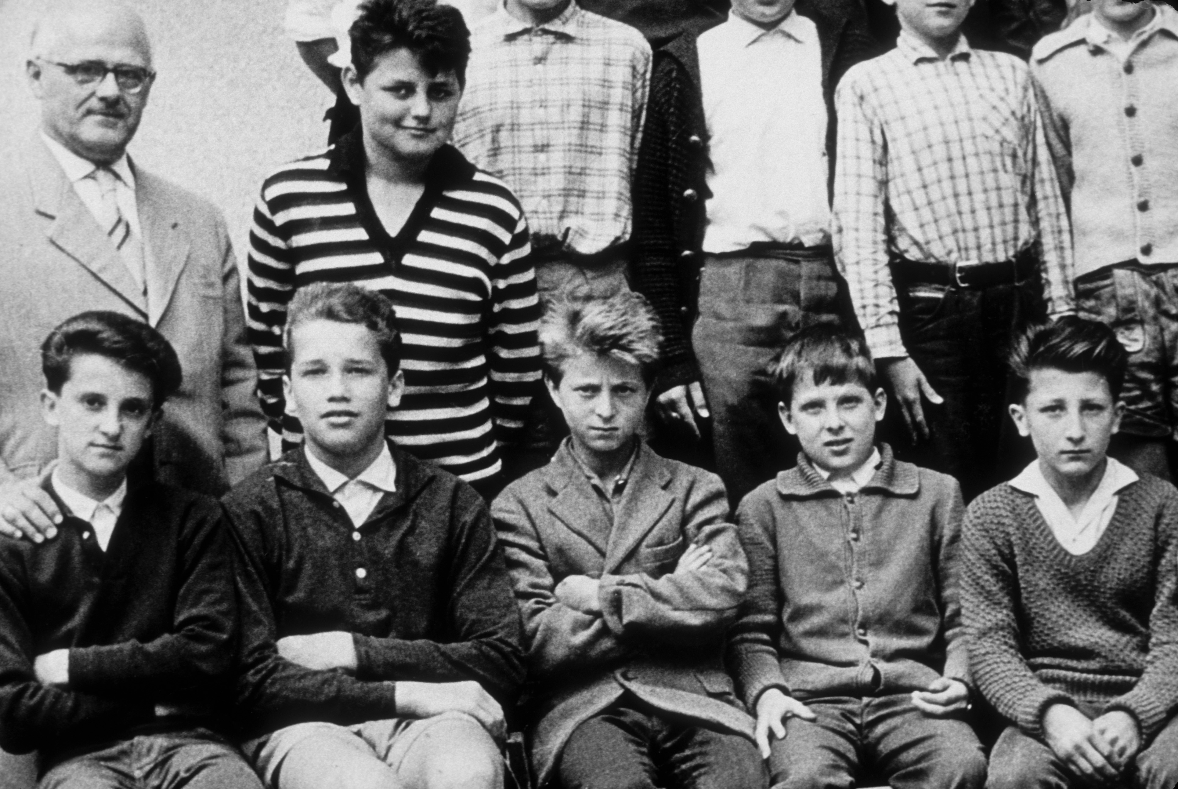 The boy (bottom row, second from left) poses for a photo with his classmates in Thal, Austria in 1958 | Source: Getty Images