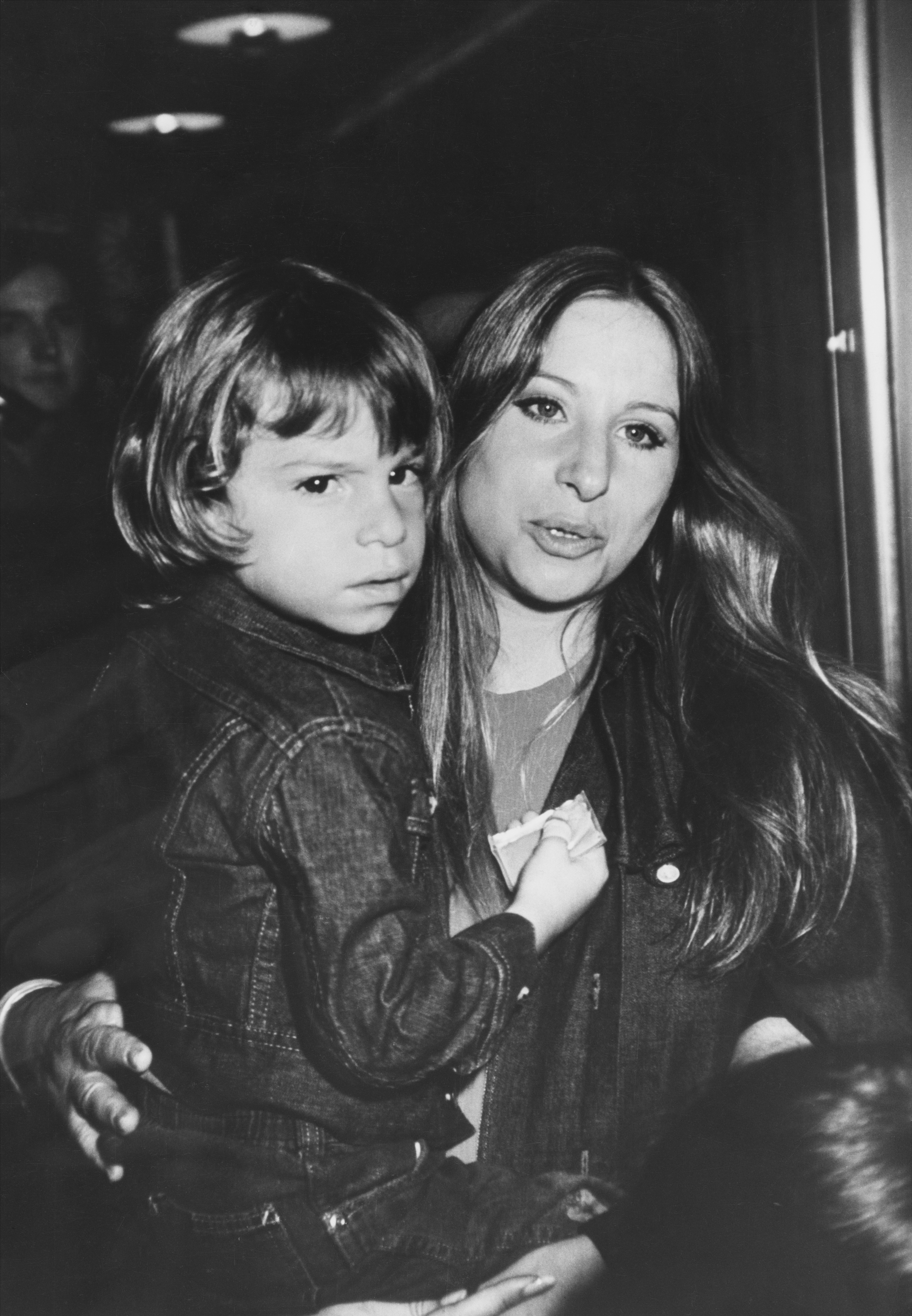 Barbra Streisand carrying her son, Jason Gould, at a screening of 'Willy Wonka & The Chocolate Factory', held at the Directors' Guild Theater, location unspecified, United States, 3rd June 1971. | Source: Getty Images