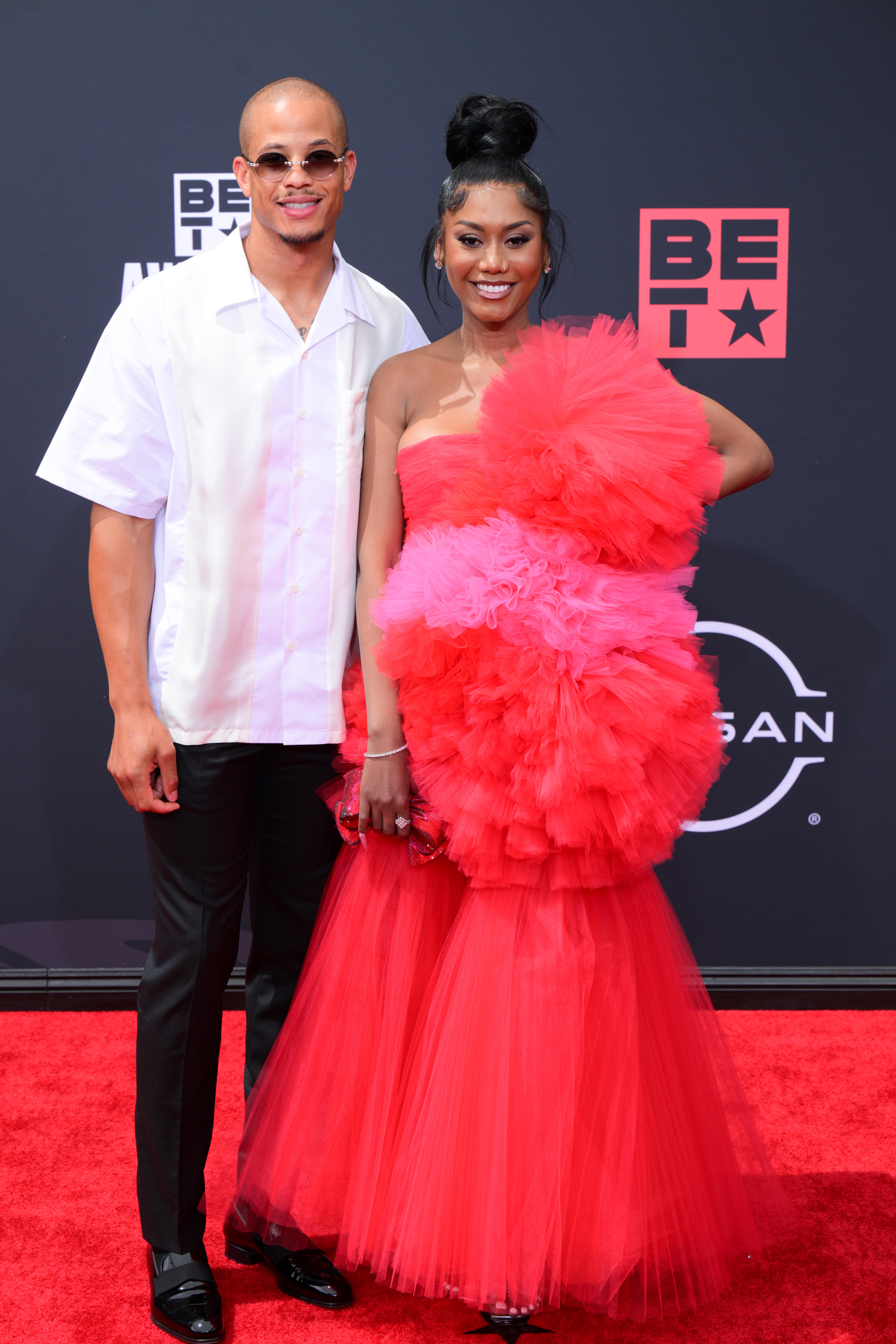 Raysean Hairston and Muni Long on the BET Awards red carpet at the Microsoft Theater in Los Angeles, California, on June 26, 2022. | Source: Getty Images