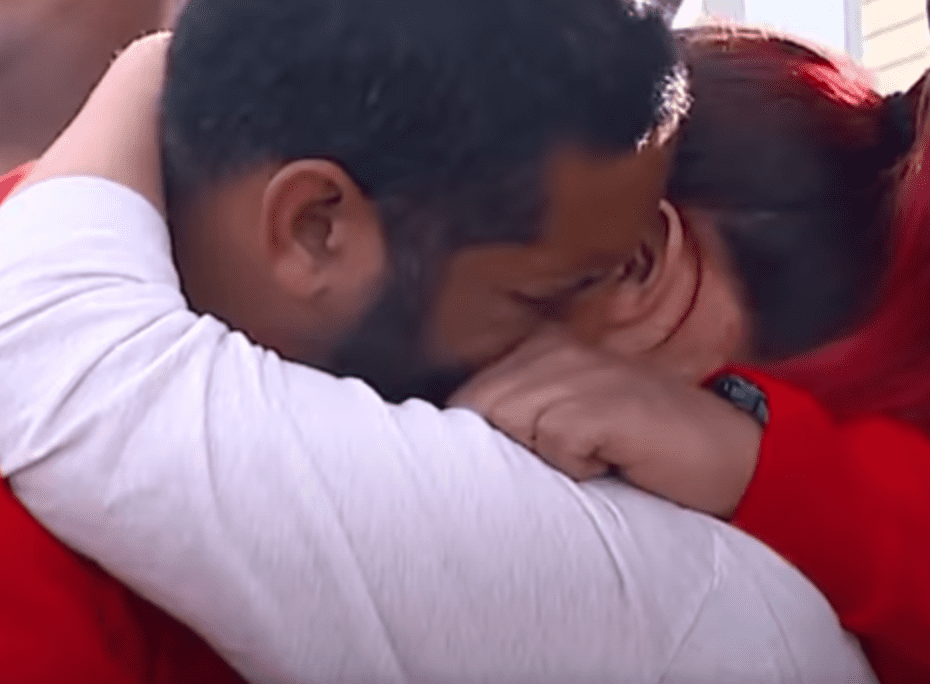 Veteran couple has an emotional embrace after they learn that their mortgage is paid off | Photo: Youtube/Good Morning America