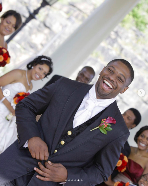 Uche Ojeh laughing as Sheinelle Jones and their wedding party beam behind him. | Source: Instagram/sheinelle_o