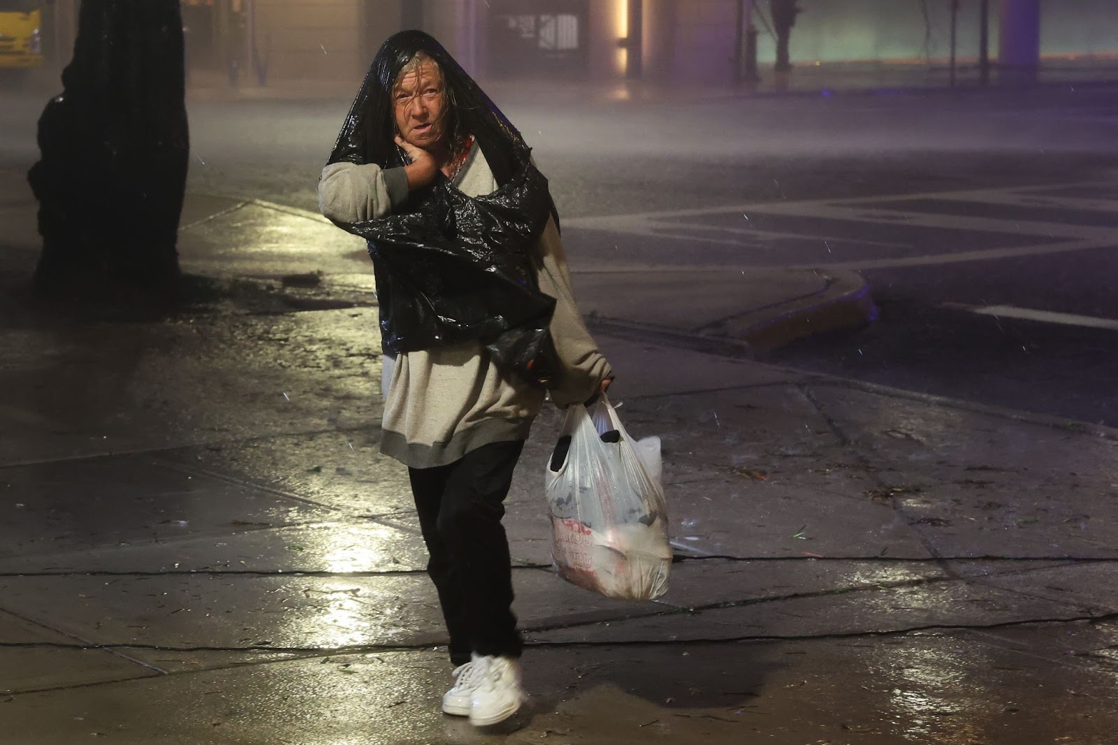 A woman walking through downtown as Hurricane Milton made landfall on October 9, 2024, in Tampa, Florida. | Source: Getty Images