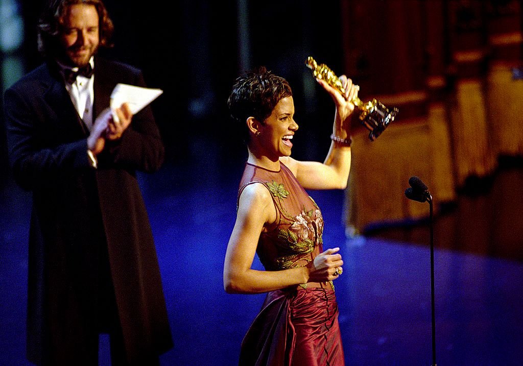 Halle Berry Accepts The Best Actress Academy Award For Her Performance In The Film "Monster's Ball," While Actor Russell Crowe Applauds Her During The 74Th Annual Academy Awards March 24, 2002 At The Kodak Theater In Hollywood, California. | Source: Getty Images