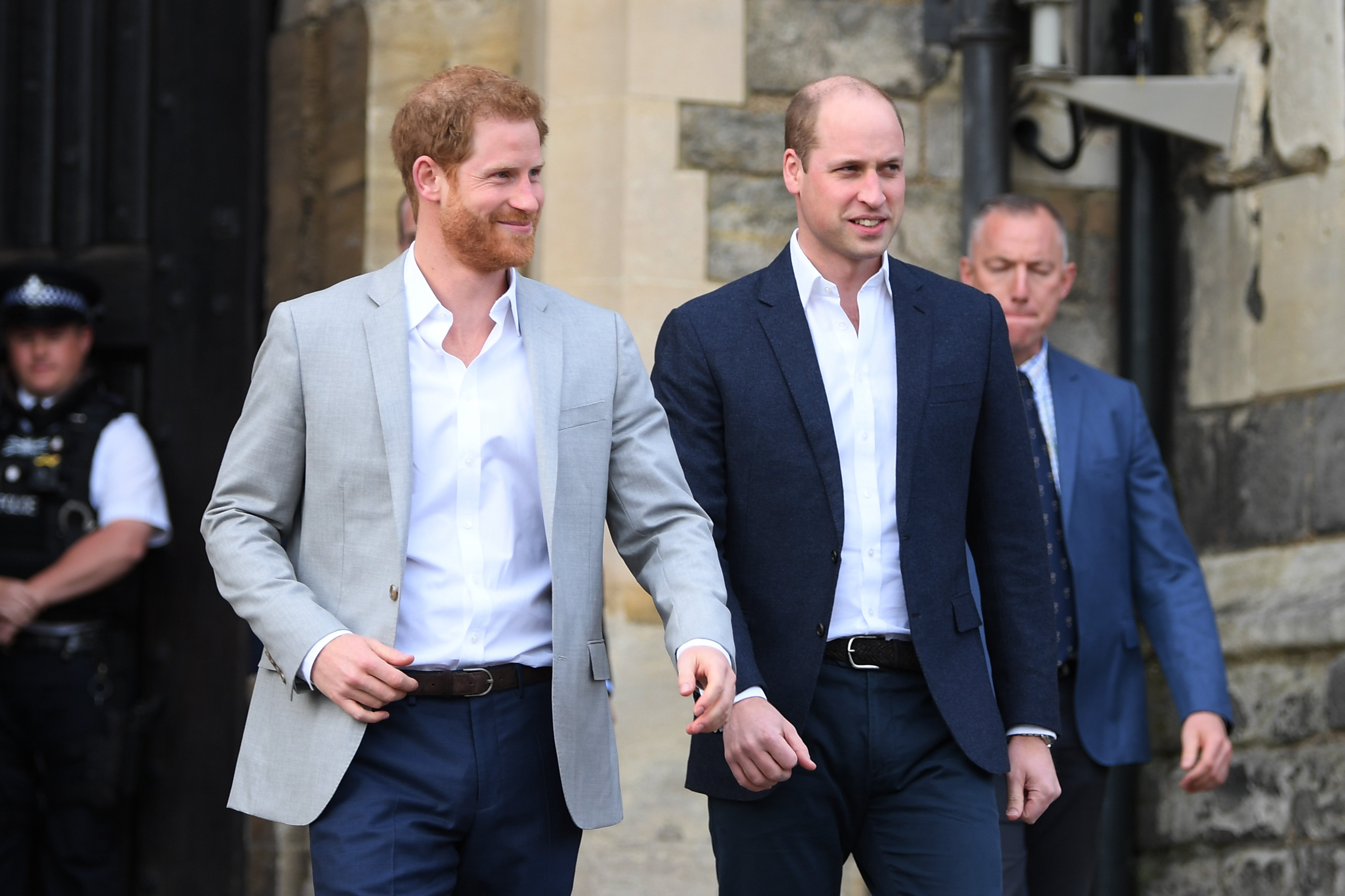 Prince Harry and Prince William, Duke of Cambridge embark on a walkabout ahead of the royal wedding of Prince Harry and Meghan Markle on May 18, 2018 in Windsor, England. | Source: Getty Images