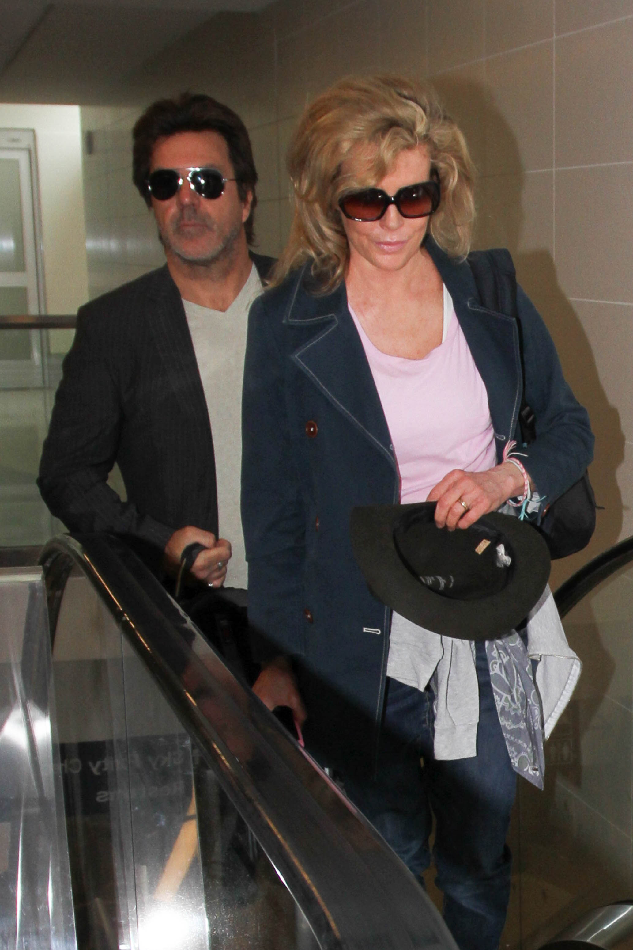 Mitch Stone and Kim Basinger are seen at LAX on June 2, 2016 | Source: Getty Images