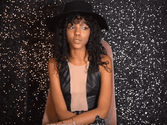 Eddie and Nicole Murphy's daughter, Zola Ivy Murphy during an interview with Global Institution | Photo: YouTube/Global Institution Eddie and Nicole Murphy's daughter, Zola Ivy Murphy during an interview with Global Institution | Photo: YouTube/Global Institution