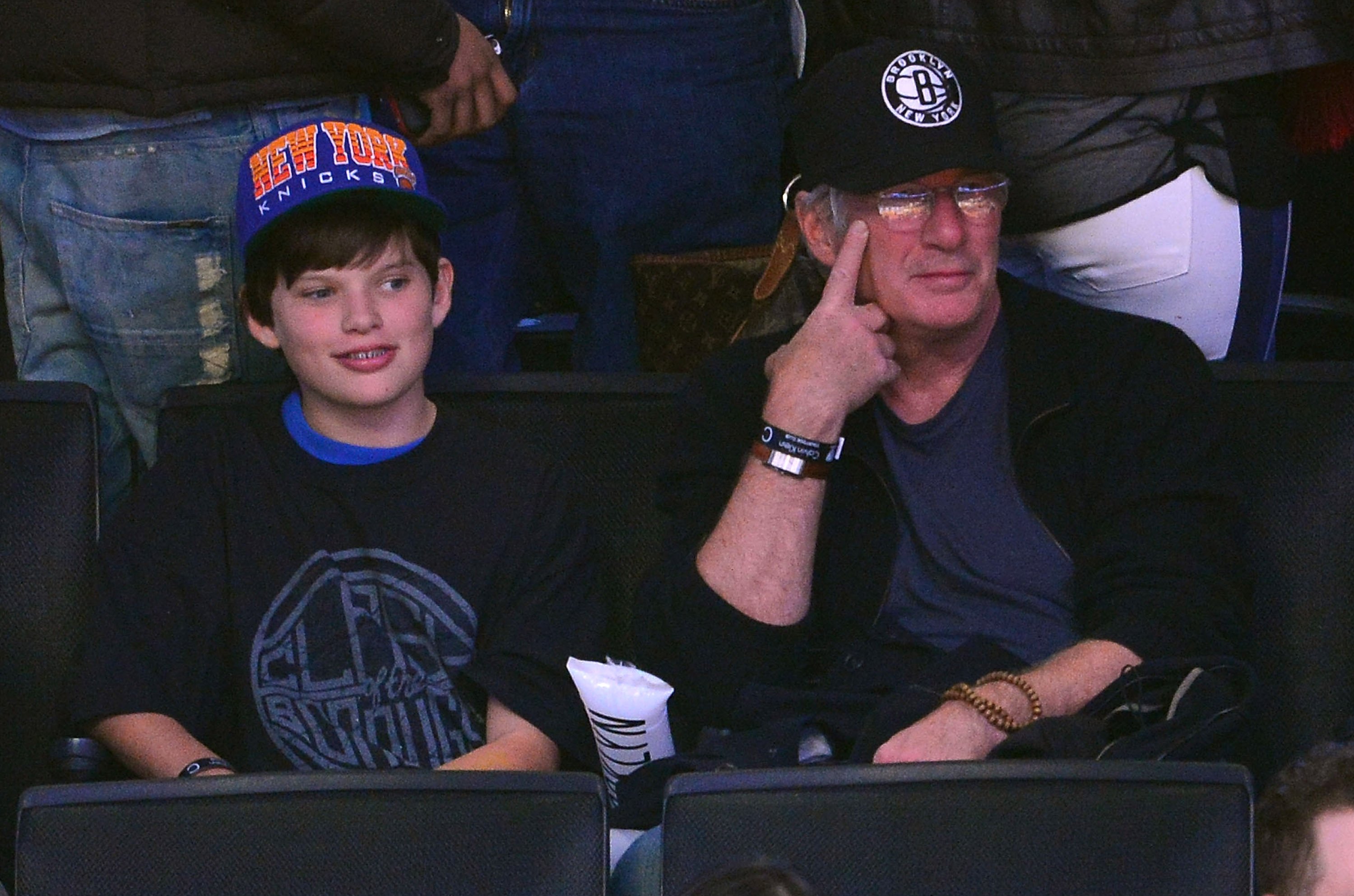 Richard Gere and Homer attend the New York Knicks v Brooklyn Nets game at Barclays Center on November 26, 2012 in the Brooklyn borough of New York City | Source: Getty Images 