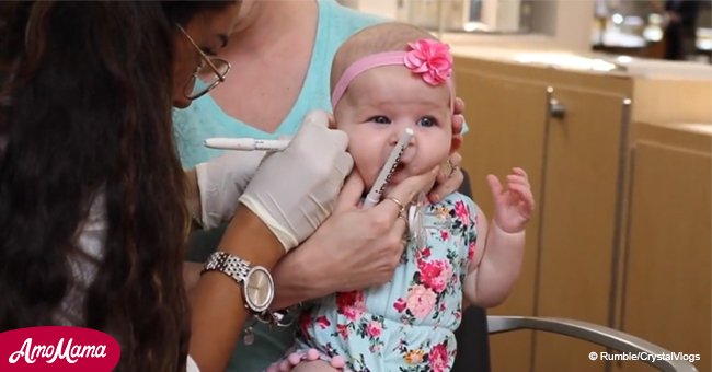 Woman pierces tiny baby girl's ears. But suddenly she screams in pain