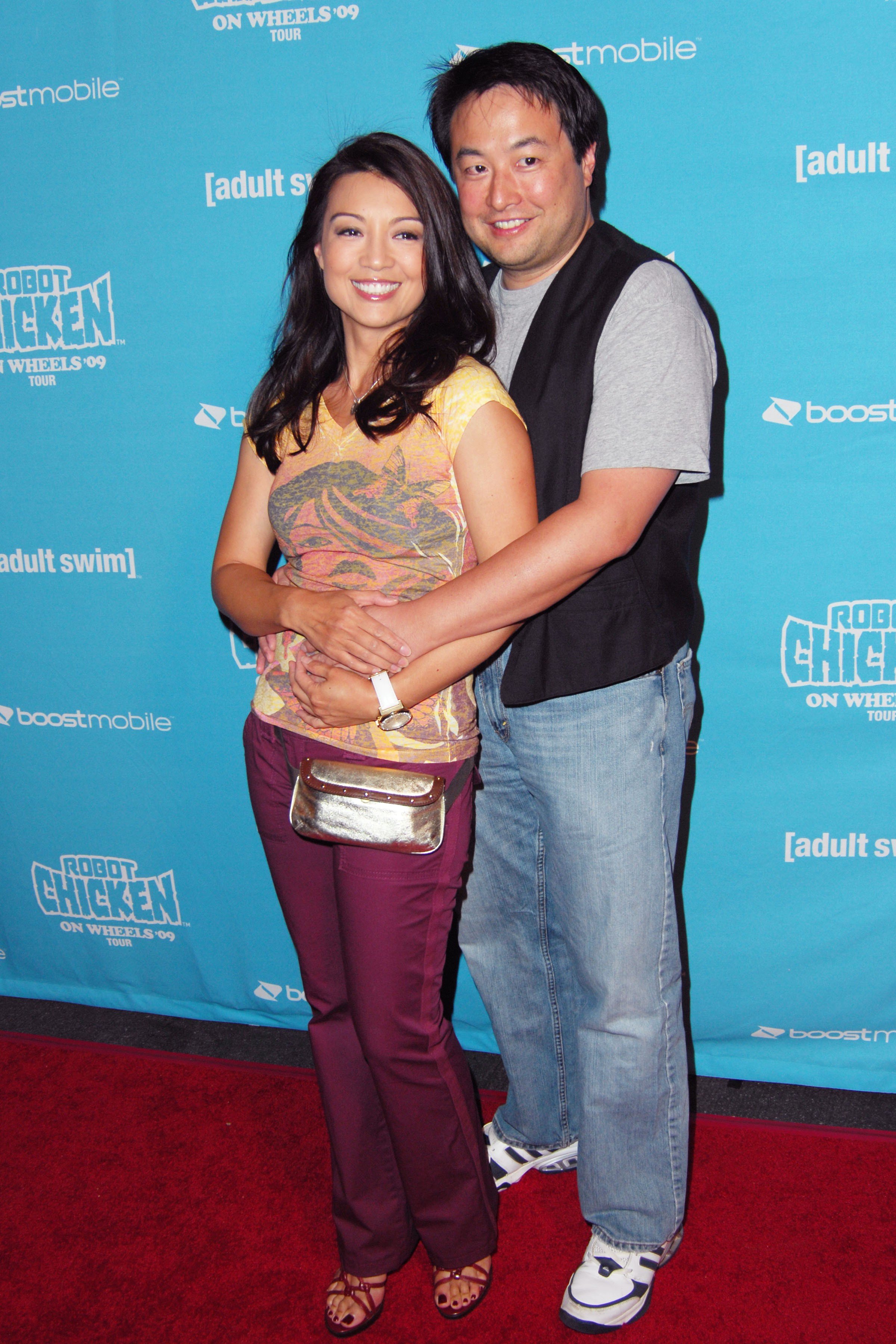 Ming-Na Wen and Eric Zee at the Seth Green and Adult Swim Present Robot Chicken Skate Party Bus Tour on August 1, 2009, in California | Source: Getty Images