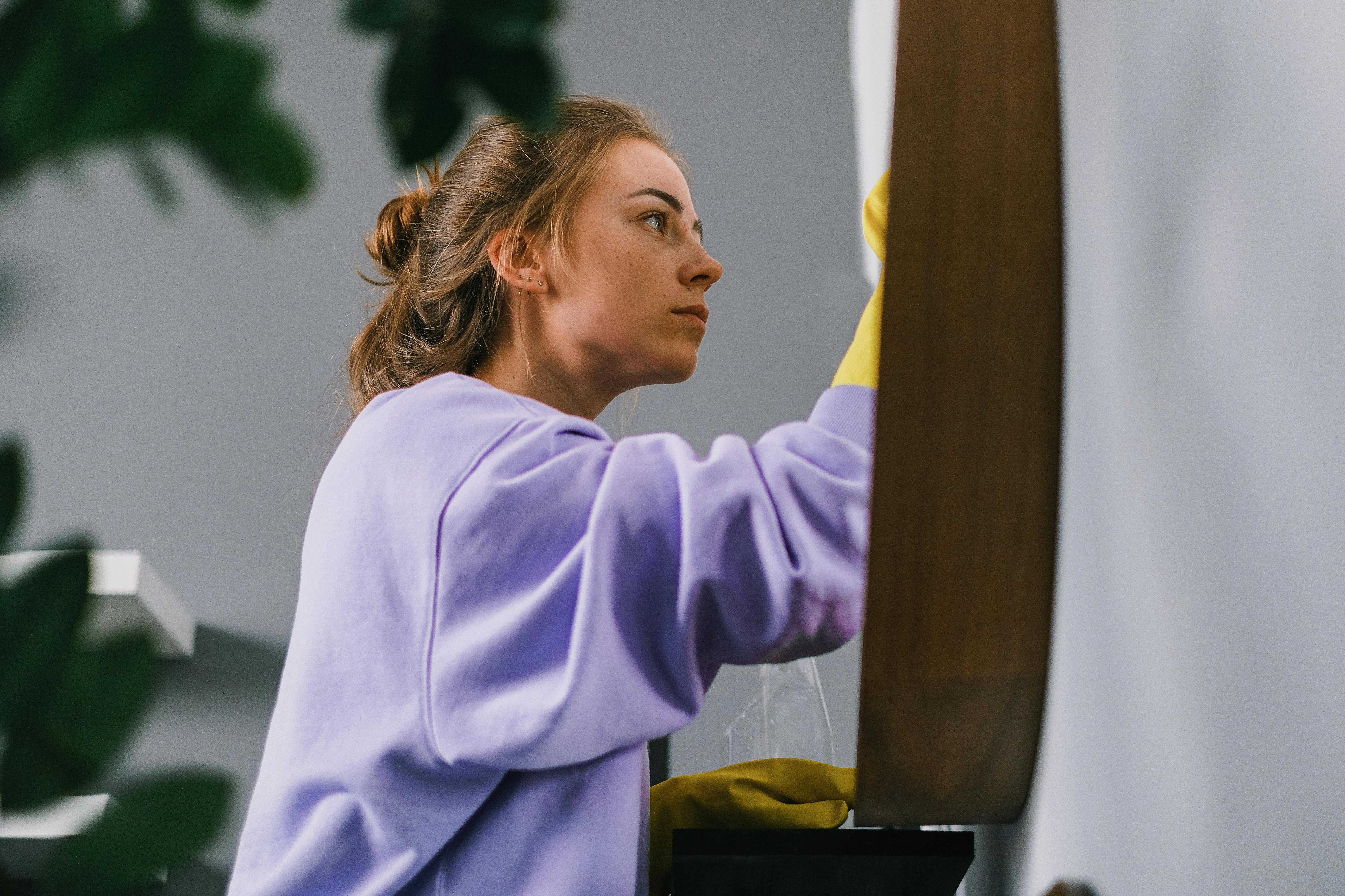 A woman cleaning her home | Source: Pexels