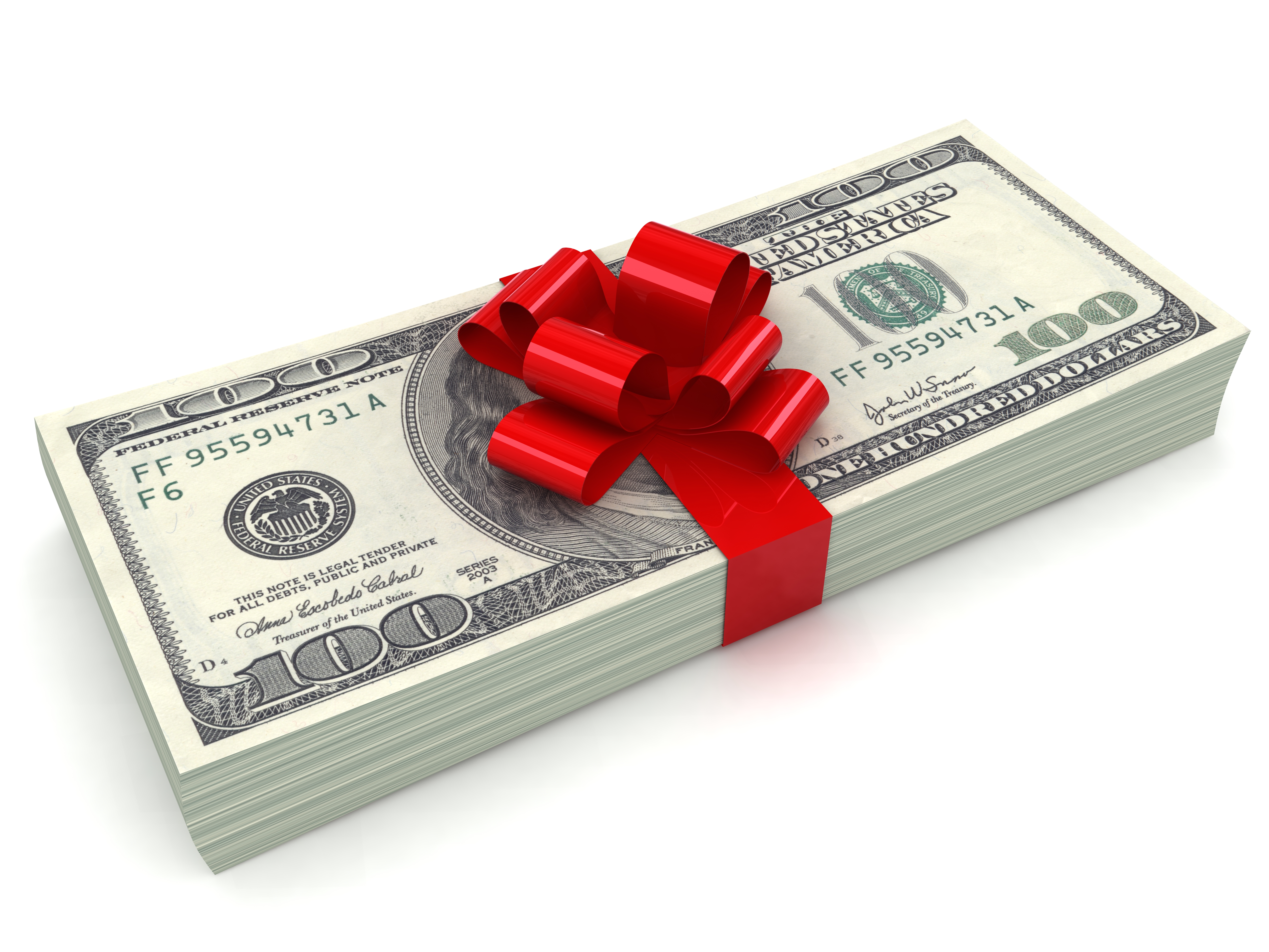 Dollar bills wrapped in a red ribbon | Source: Getty Images