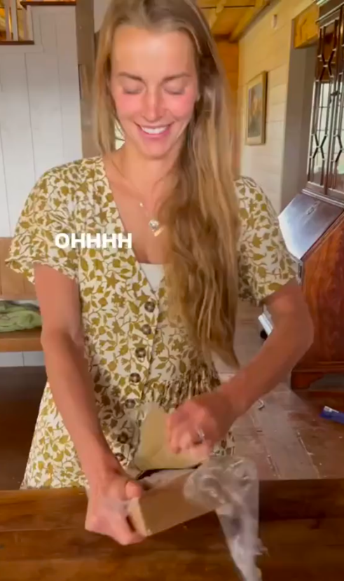 Hannah Neeleman opening a birthday gift from Daniel Neeleman, posted on July 5, 2024 | Source: TikTok/hannal.ballerinafarm