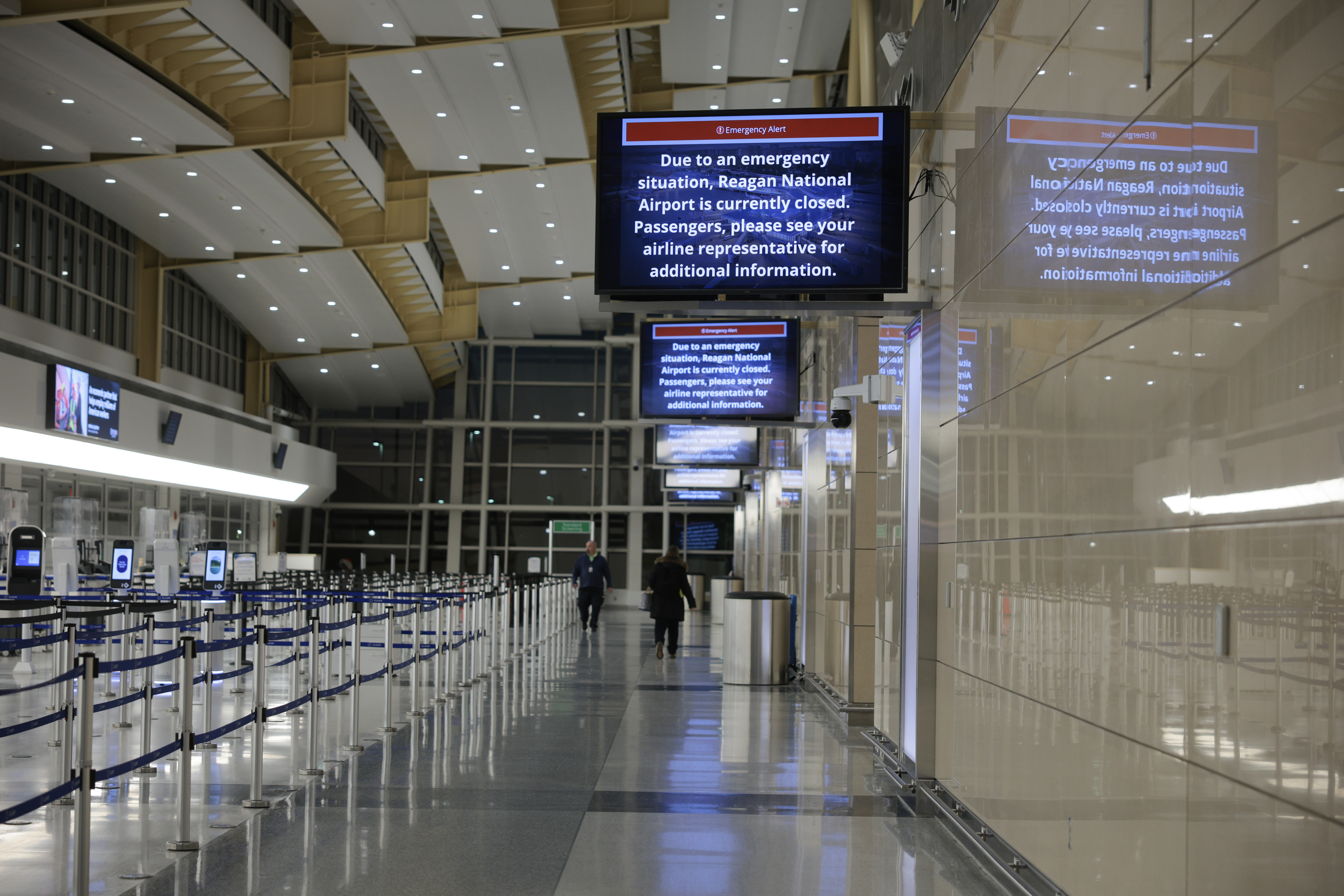 A sign indicating the closure of Reagan National Airport in Arlington, Virginia on January 30, 2025. | Source: Getty Images