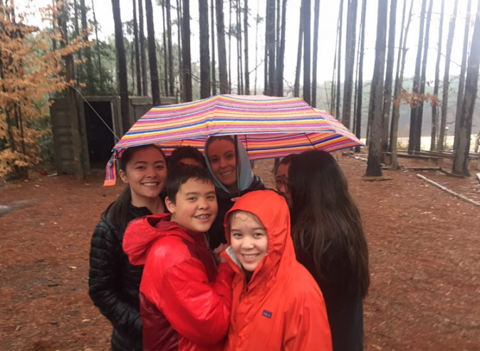 Kate used her platform to keep promoting her reality television show. In this photo, she and her children posed together in the rain on October 1, 2019. | Source: Instagram/kateplusmy8