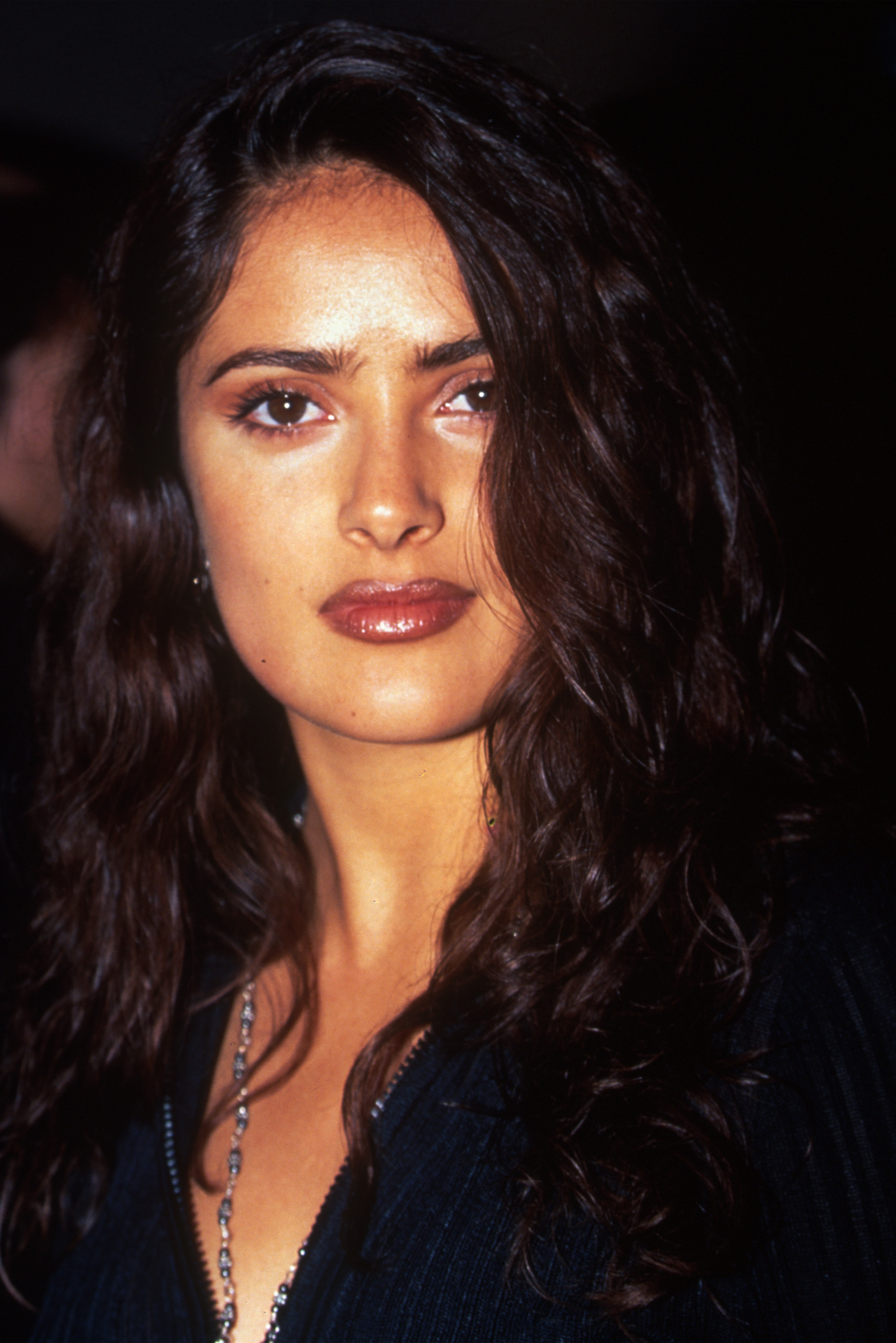 A younger Hayek was already known for her striking screen presence and instantly recognizable features. Years later, close-up photos like this became part of the comparison as fans debated how her look has evolved.