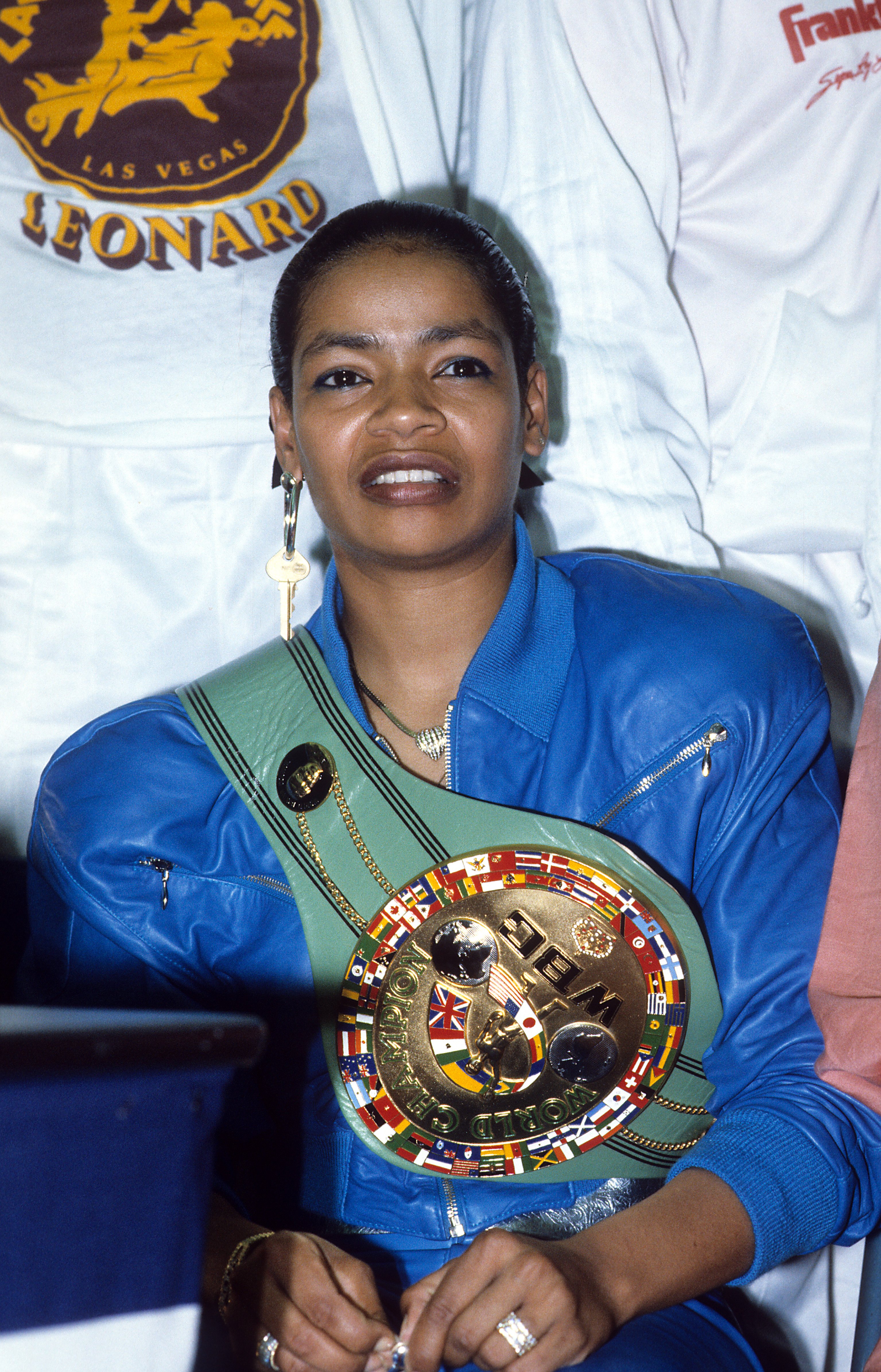 Juanita Wilkinson wears Sugar Ray Leonard's championship belt during a press conference after the fight against Marvin Haglerat at Caesars Palace, on April 6, 1987, in Las Vegas, Nevada. | Source: Getty Images