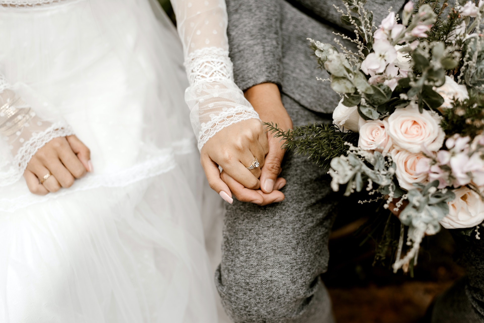 Bride and groom holding hands | Source: Shutterstock