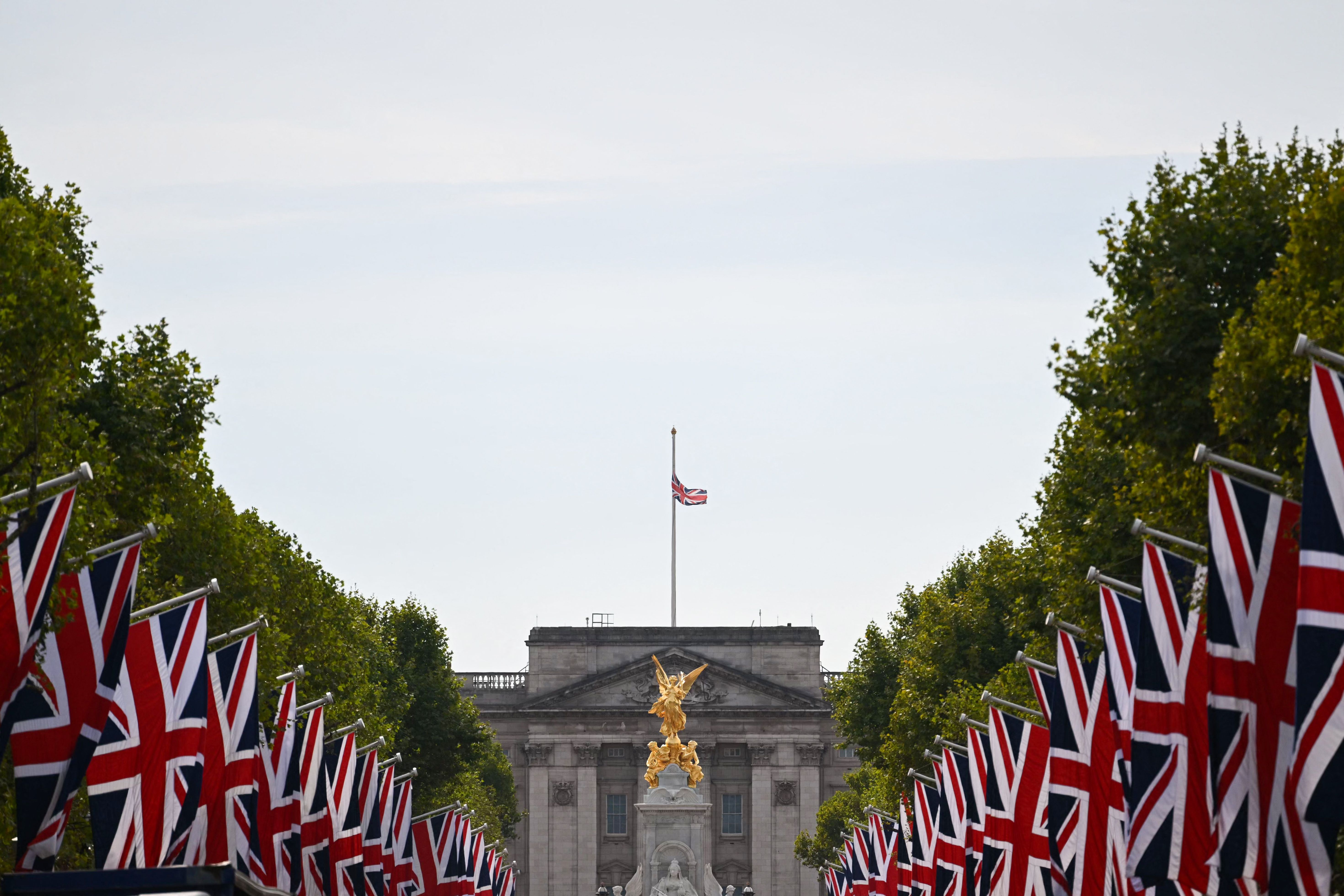 The Britain national flag flies half-mast at Buckingham Palace in London on September 12, 2022, following the death of Queen Elizabeth II on September 8, 2022 | Source: Getty Images 