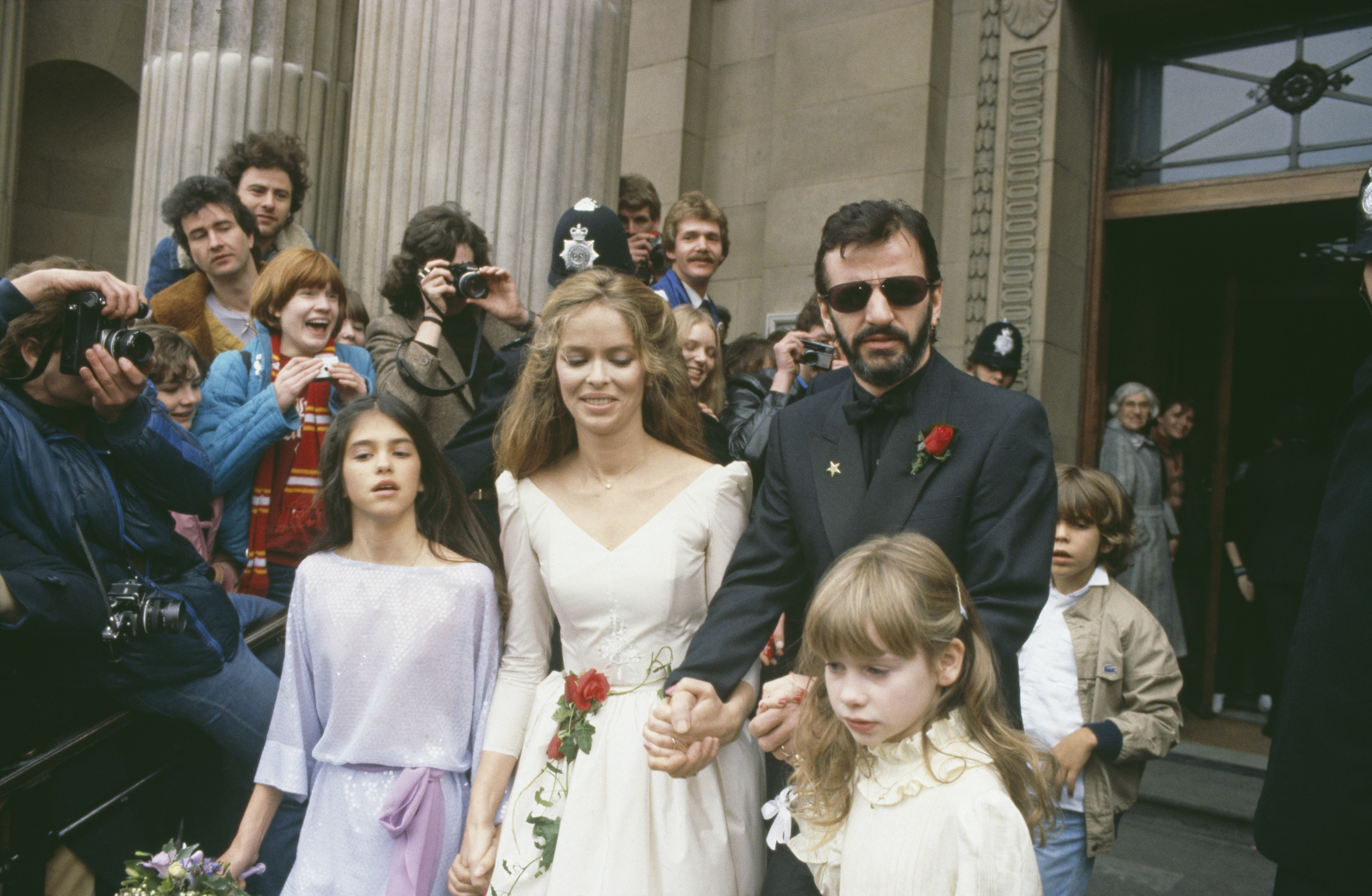 Ringo Starr and Barbara Bach leaving Marylebone Register Office after their wedding in London, April 27, 1981, with their bridesmaids, Bach's daughter Francesca Gregorini and Starr's daughter Lee Starkey on April 27, 1981 | Source: Getty Images