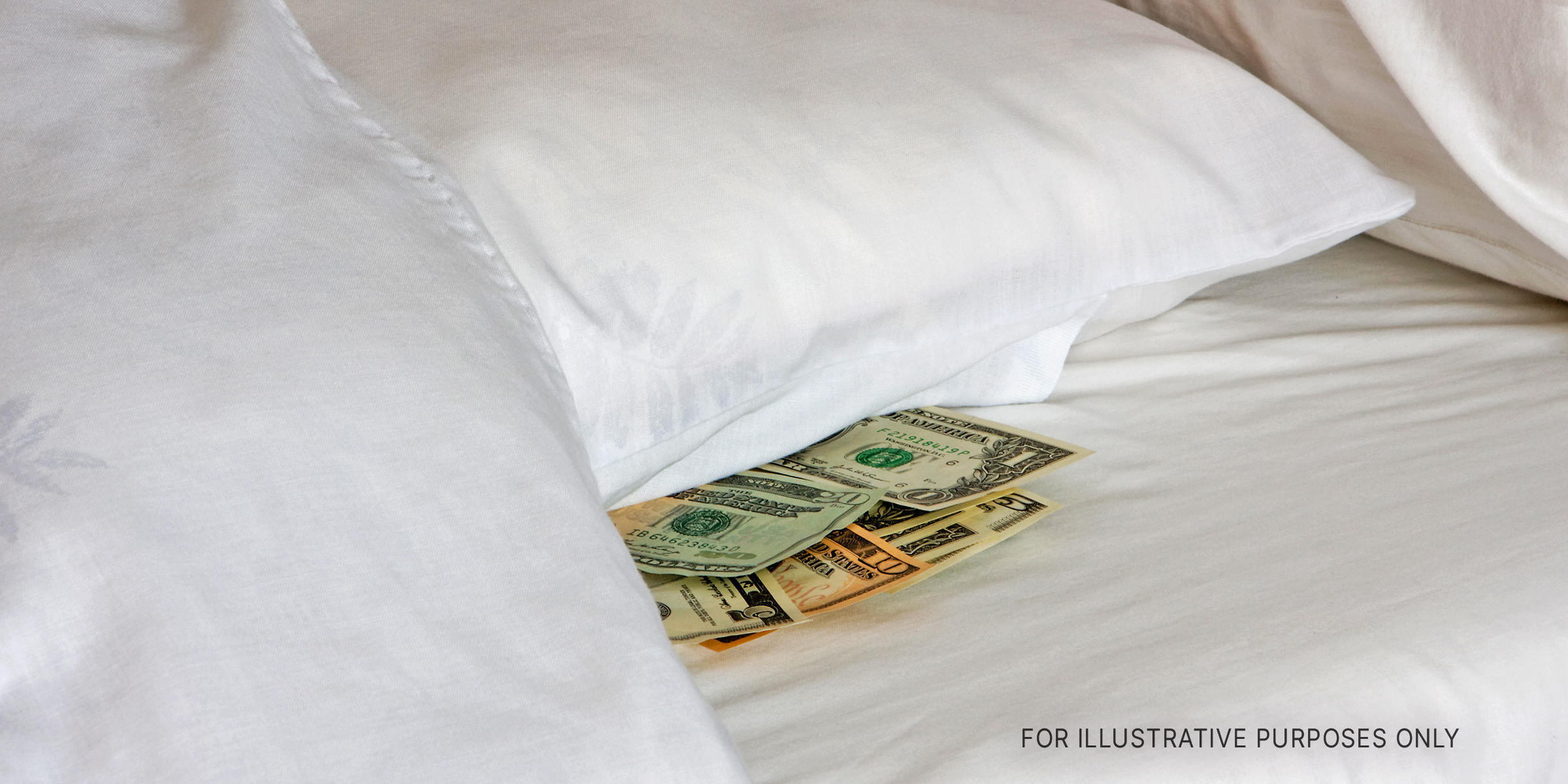 Money Tucked Away Under Pillow. | Source: Shutterstock