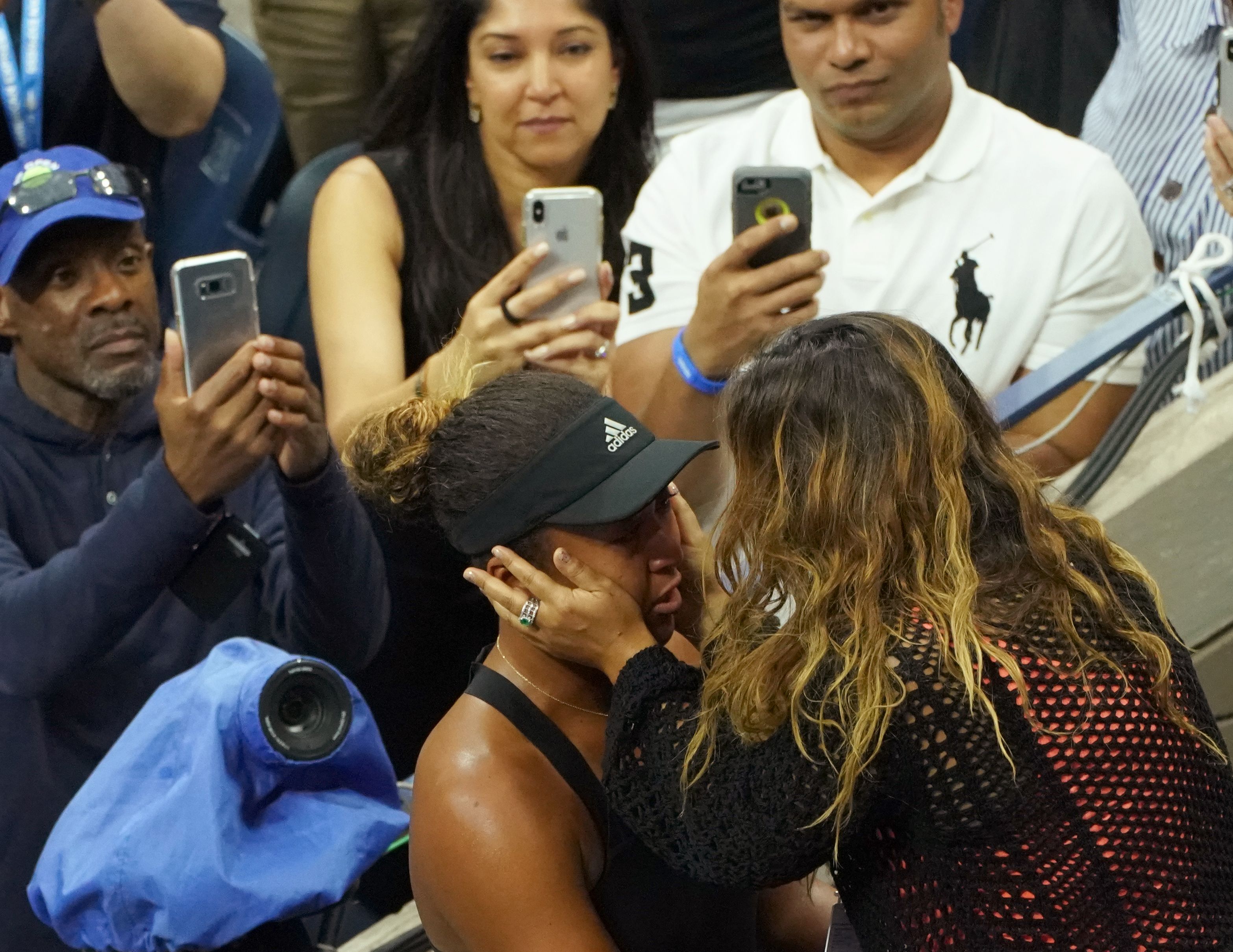 Naomi Osaka being embraced by her mom, Tamaki Osaka, after her victory over Serena Williams in their 2018 US Open women's singles final match in New York on September 8, 2018. | Source: Getty Images