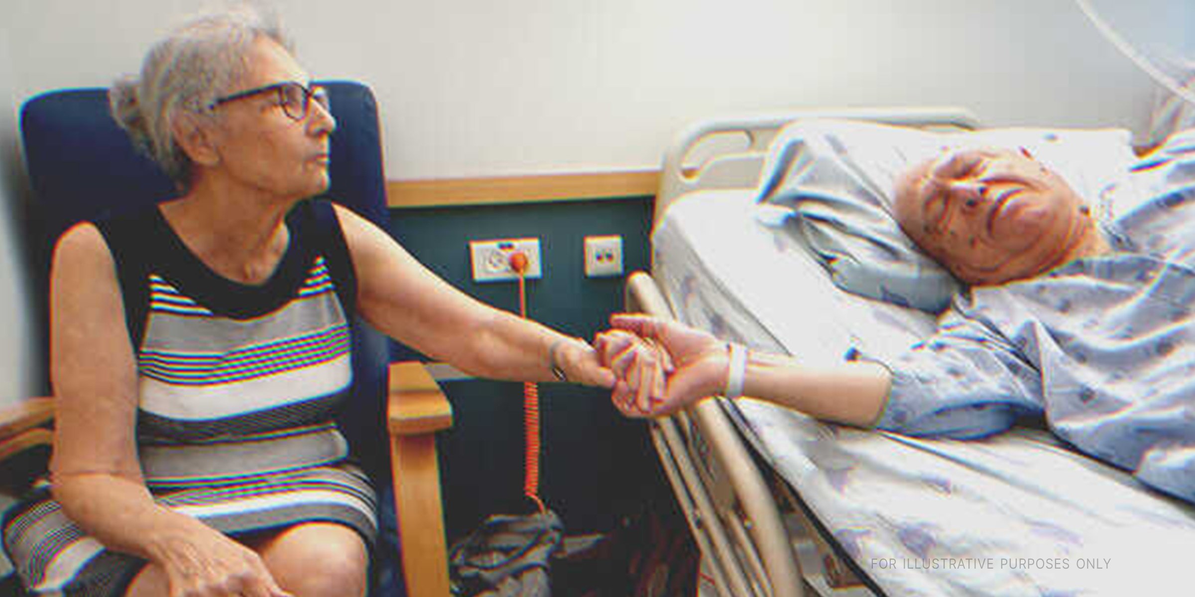 Wife holding ailing husband's hand. | Source: Shutterstock