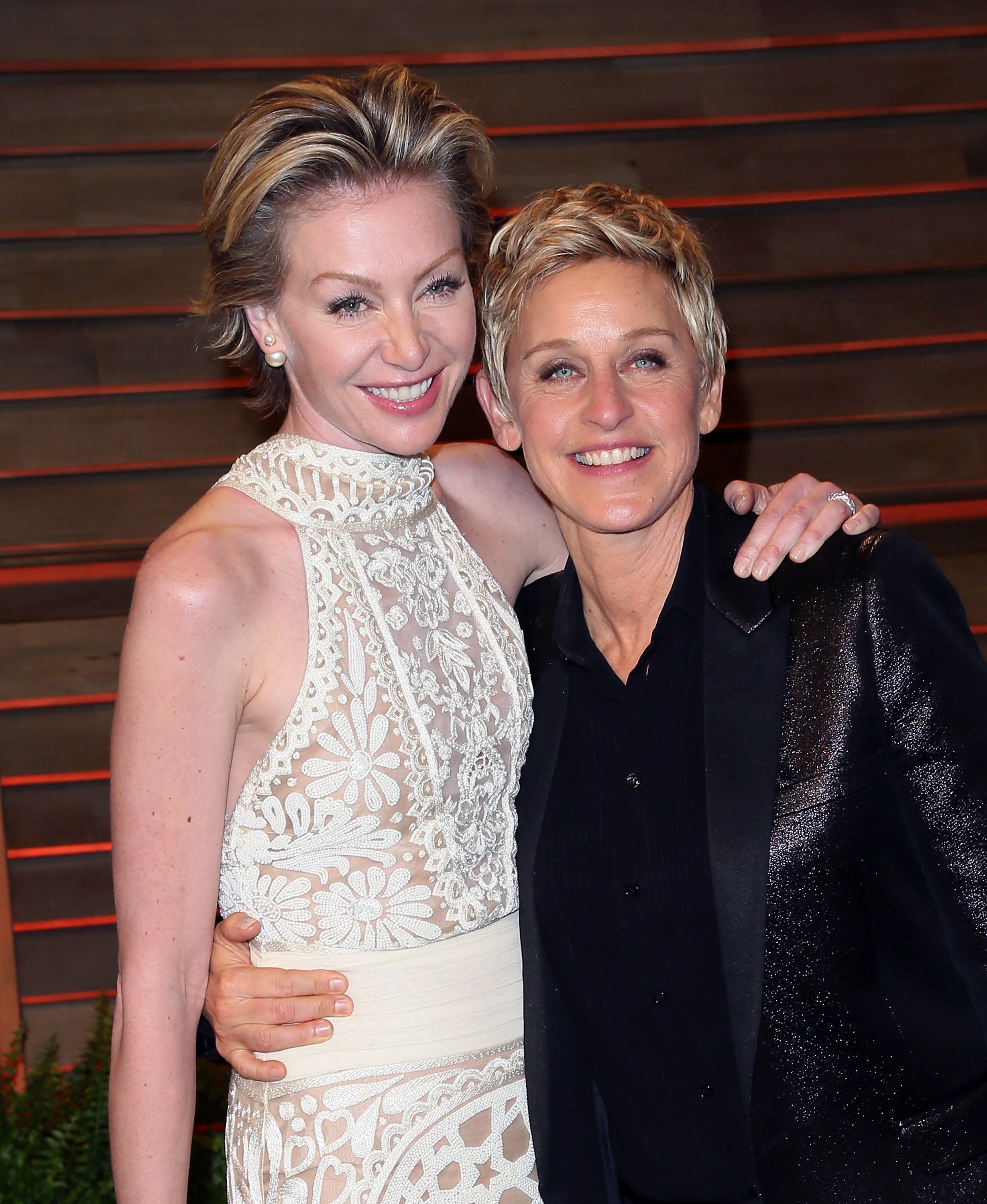 Ellen DeGeneres (R) and spouse actress Portia de Rossi attend the 2014 Vanity Fair Oscar Party hosted by Graydon Carter on March 2, 2014, in West Hollywood, California. | Source: Getty Images.