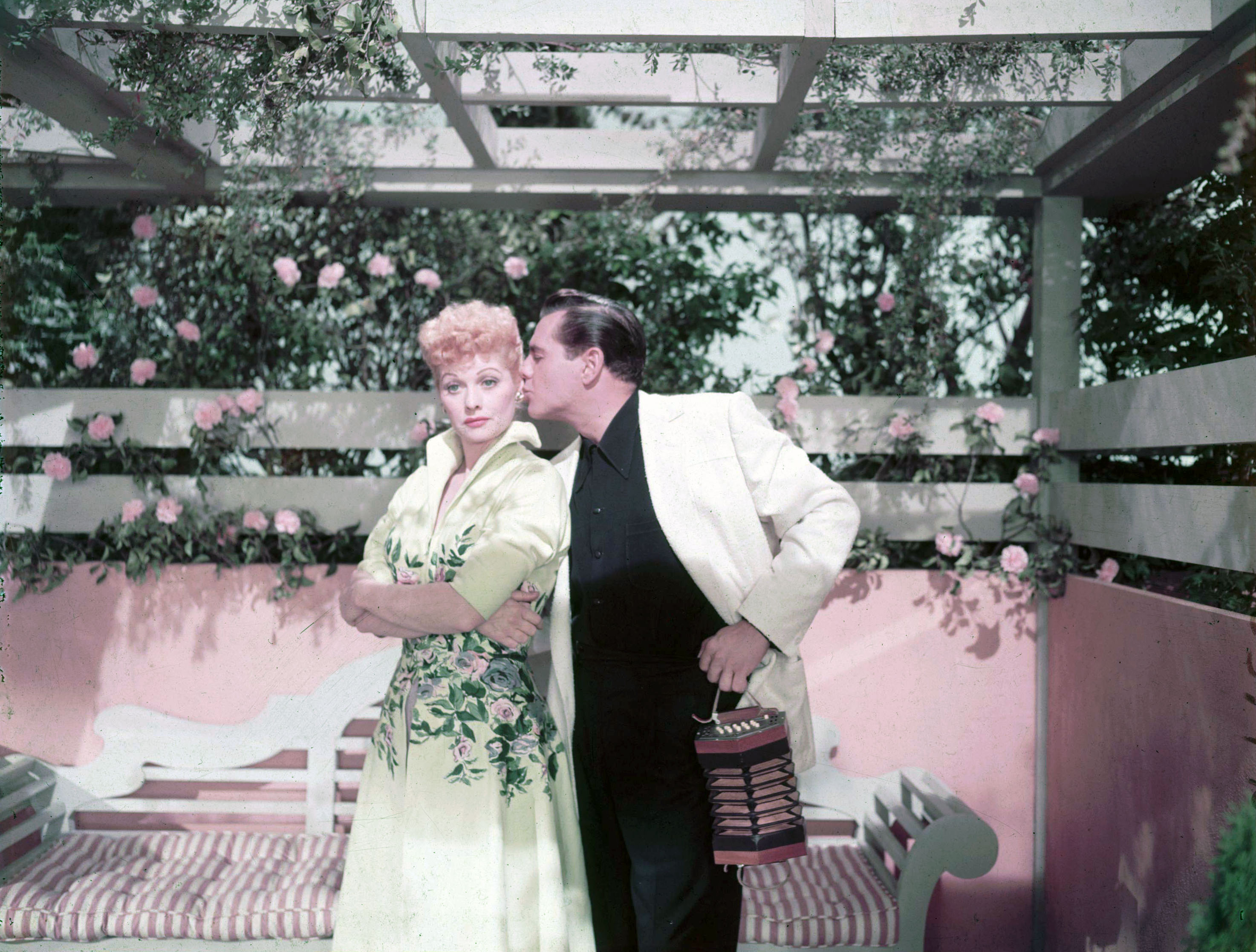 Lucille Ball and Desi Arnaz posing for a pictue circa 1951. | Source: Getty Images