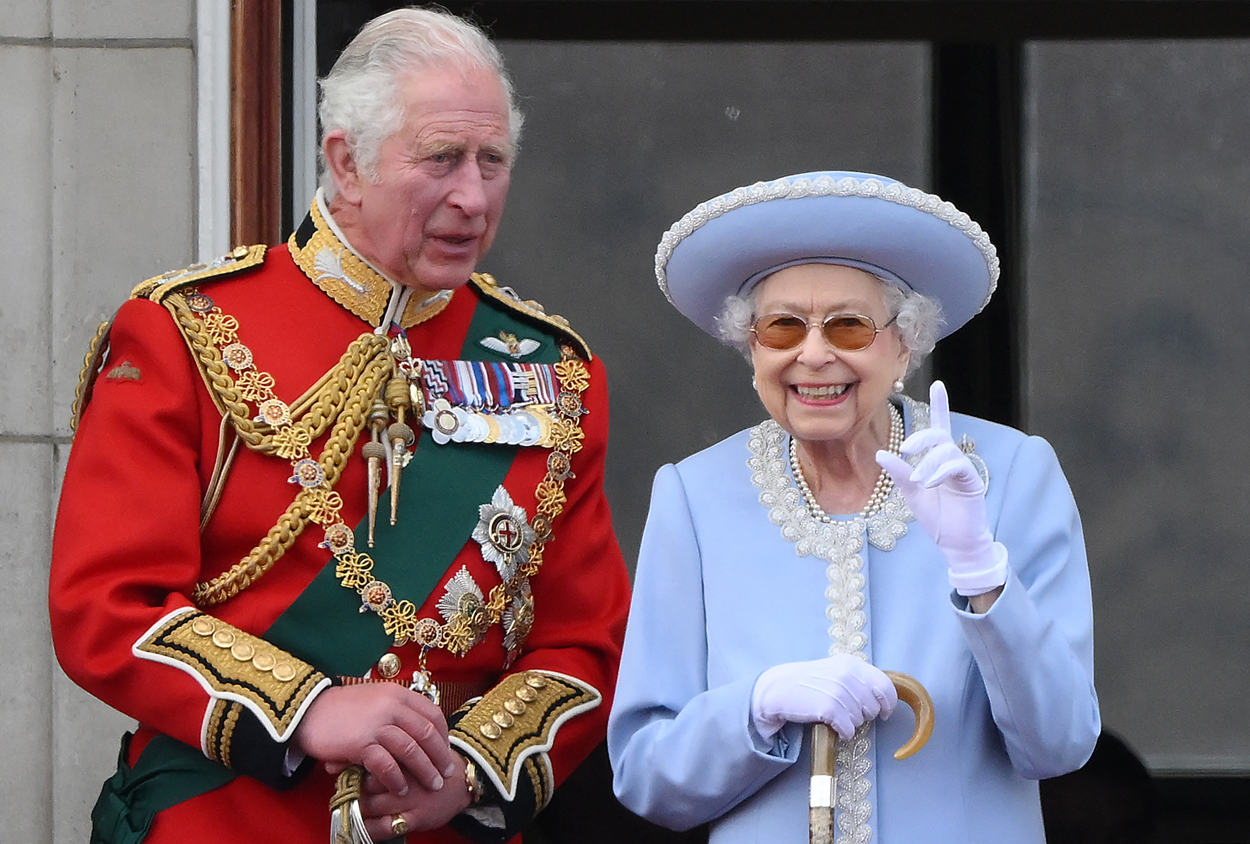 King Charles and Queen Elizabeth II watch a special flypast from Buckingham Palace balcony during the Trooping the Color on June 2, 2022 in London. | Source: Getty Images